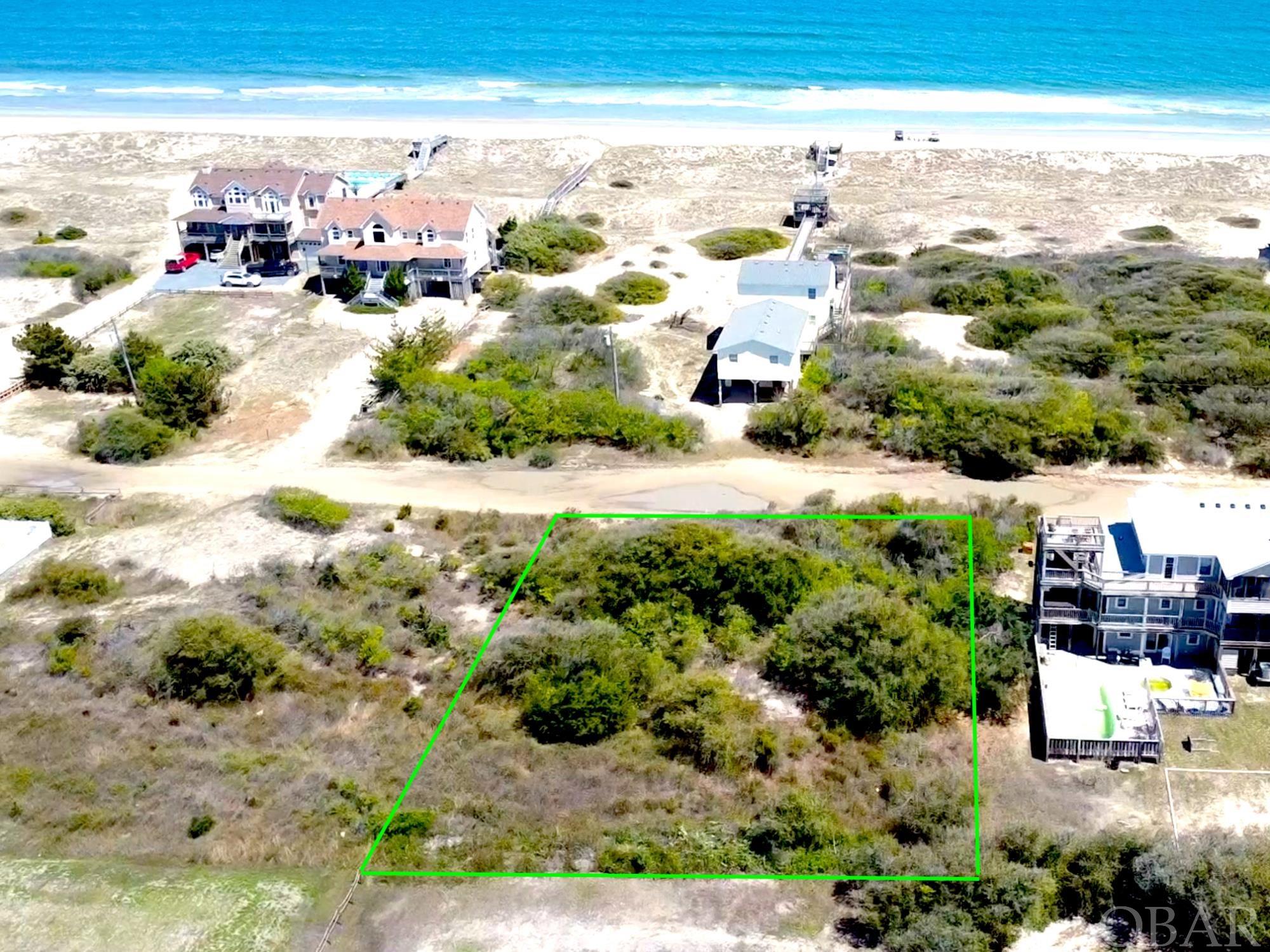 Amazing Ocean Views from this 2nd Row, Semi-Oceanfront lot in Carova's wild & wonderful 4x4 area of the Outer Banks.  This rare, pristine, flat lot will deliver 360-degree ocean views from the decks of your future dream home.  The lot's close proximity to the nearest beach ramp, provides easy access to the most spacious beach in Carova.  Wild horses roam your property and will be frequent visitors as you enjoy your your morning coffee while overlooking one of the last untamed areas of the Outer Banks.