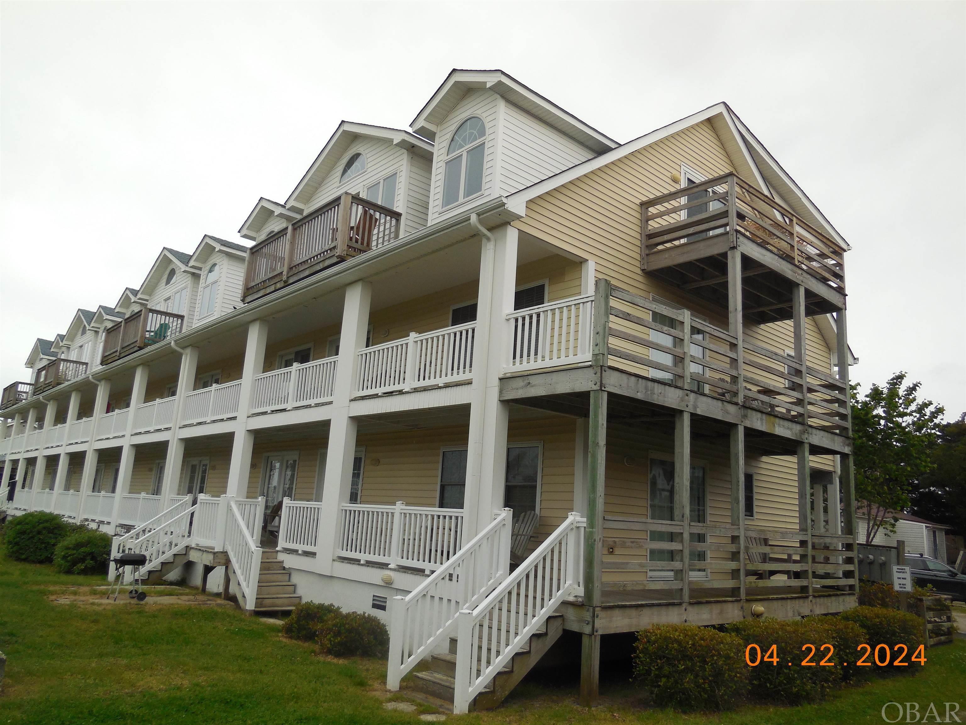 A 2 bed/2 full bath, end unit, penthouse condo, centrally located in Ocracoke village, within walking distance to everything Ocracoke has to offer! 2 gracious owner suites, each with a bathroom consisting of a large jetted tub and separate shower. Oak floors in all living/sleeping spaces and tile in bathrooms. New HVAC system in 2023 (July)! Open kitchen/living/dining area with access to a small deck overlooking the front lawn with a view of the beautiful new Island Inn gardens. A park with wonderful flowers, meditation area, benches and convenient tram stop. Central heat/ac, ceiling fans, recesssed lighting, large closets and plenty of windows for natural light. There is an additional Juliette deck off one of the bedrooms; a great place to enjoy your morning coffee, an afternoon drink or late night stargazing! Conveys fully furnished (excluding some personal artwork). This unit is currently a vacation rental but could easily transition into a year round residence or second home. Condo complex offers golf cart charging stations, bike racks, off road parking, grilling area and a large grassed yard for outdoor activities.
