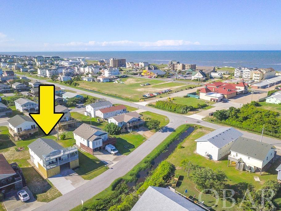 Nicely Updated & Well Maintained Cute Beach House Located in the Heart of Kill Devil Hills & the Outerbanks. Close to Numerous Shops, Restaurants & Bars & only 1.5-2 Short Blocks to the Beach. Located in a nice quiet neighborhood and has Great Rental Income history.  Walk to no less than 8-10 restaurants & the Beach in less than 5 minutes. Whether you are into Walks on the Beach, Live Music, Local Breweries, Seafood Buffets, Some of the Best Burgers on the OBX,  Excellent Pizza & even Dairy Queen is nearby, Blue Fish Cottage is right around the corner from all of these & much, more! Roof was replaced in 2017. Newish (replaced since 2020 or more recently)  Remodeled Bathrooms,  New LVP Flooring, Interior paint, Oven/Range, Dishwasher, Washing Machine, Window coverings, Most Beds & Mattresses, Sofa & Chair. Large outdoor shower, Storage room and outside sitting area in carport area. One of owners is a Licensed NC Realtor.