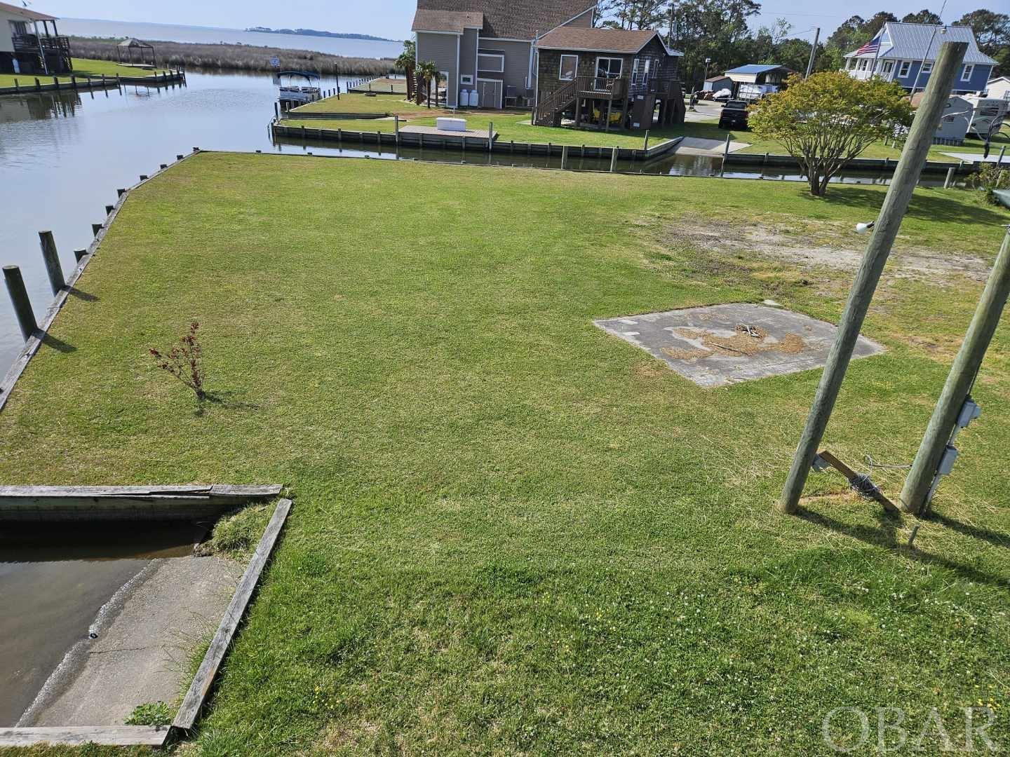 Call Steve Jernigan at 252-489-5007 for info.  Great lot for an outdoor lifestyle with Corner/Canalfront Deep Water access to Currituck Sound.  Quiet neighborhood for any taste from weekend getaway, second or family residence.  Central to all regional activities and historical venues.  To many options to list( Build your own, to suit, modulars, etc)