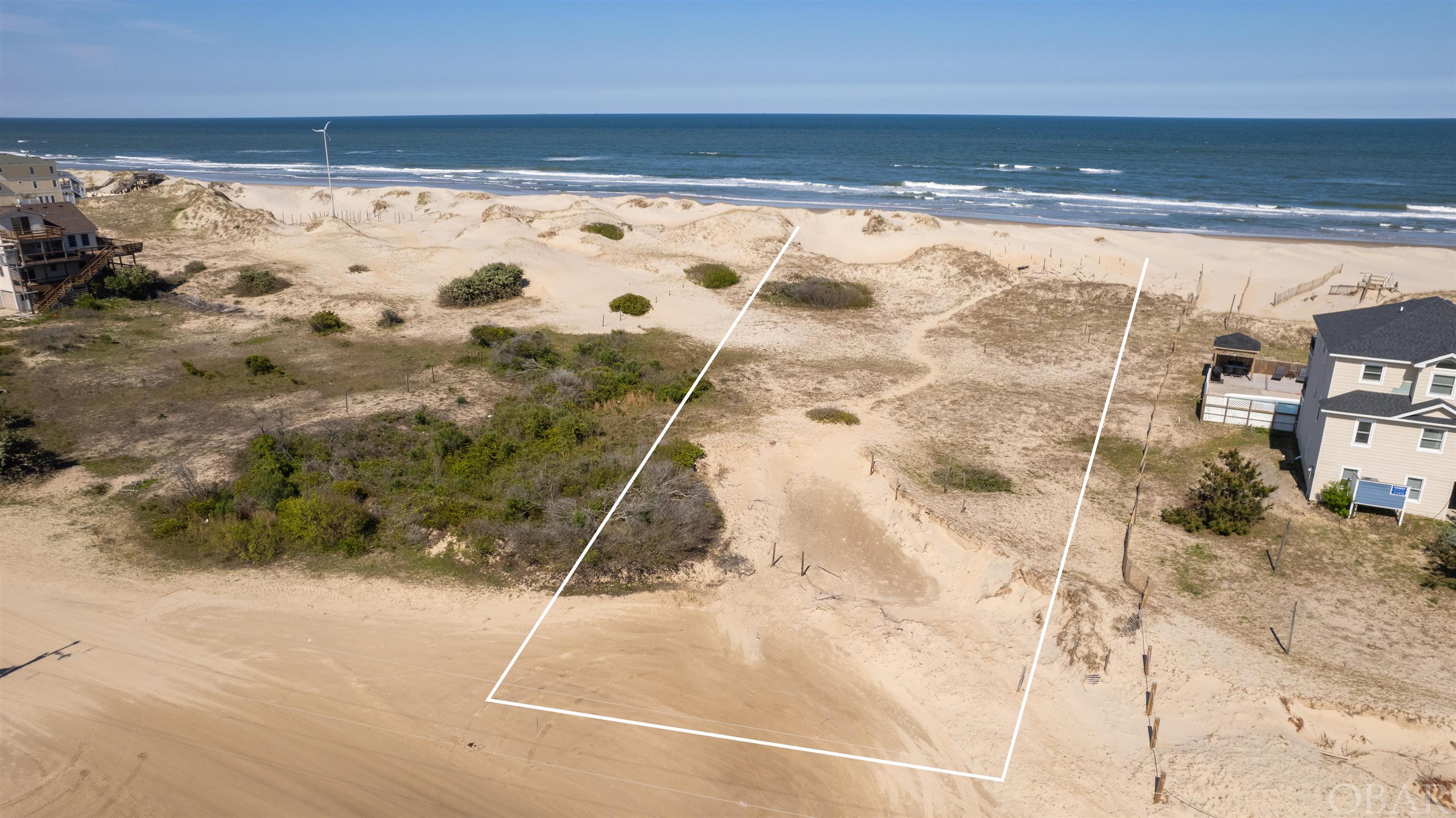 Quality 80' wide Oceanfront lot offering with great elevation and massive stable dune line.  This lot could support a sizable home if desired and would be great for either a personal beach house or a high-potential vacation rental investment.  Additional 10ft easement on the South side of the lot for an additional buffer from the neighboring property.  Majority of building envelope located in the x flood zone!  Lot sits on the widest beach in the 4wd area.  Give this one a look!