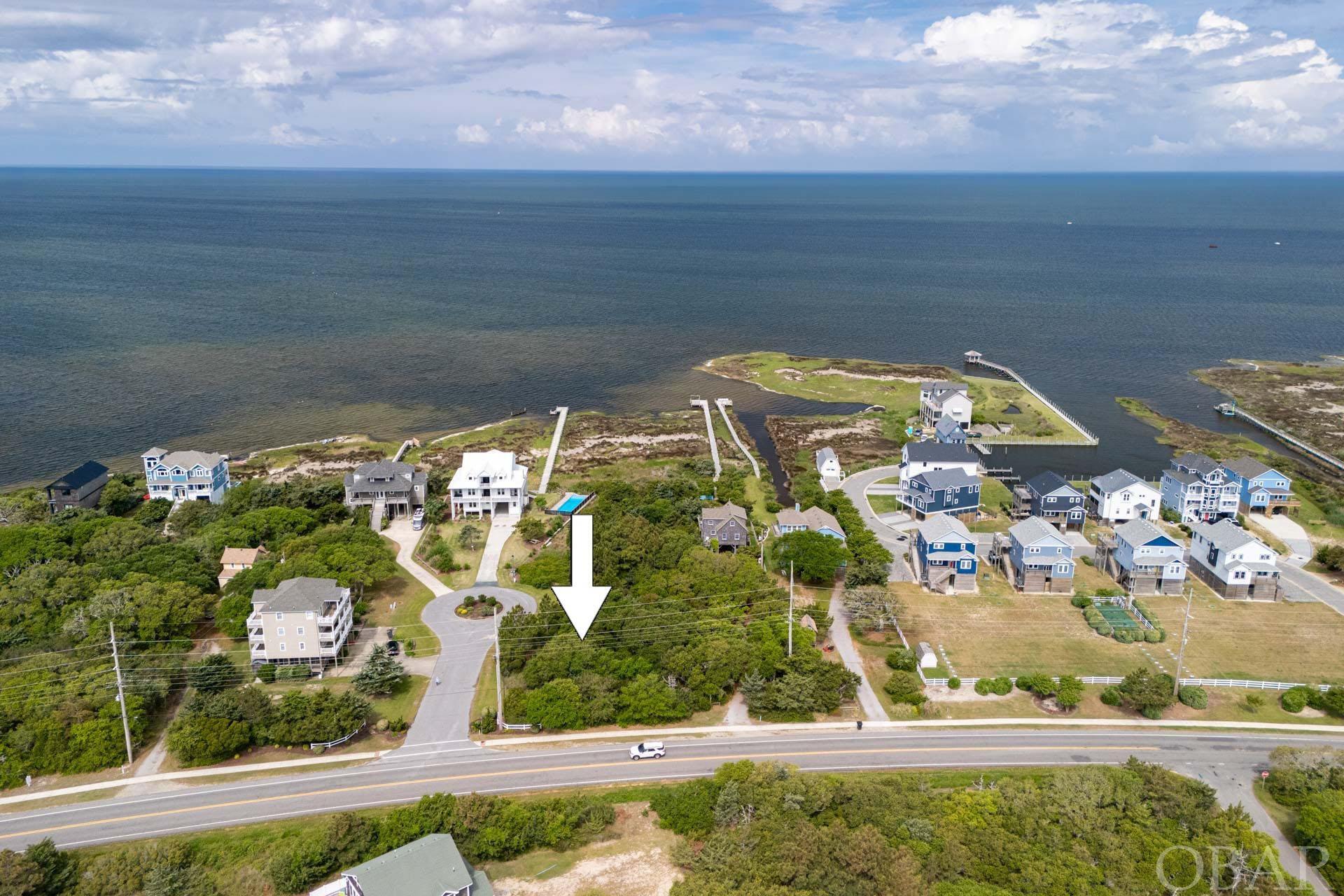 Semi Sound front homesite with potential for beautiful water views over the Pamlico Sound!  Situated on a 15,000 sq. ft. homesite in the South Beach subdivision of Salvo NC, this corner lot is ideally located on a cul-de-sac towards the South end of Salvo, close to Ramp 23 and the 4x4 beach access!  This property is adjacent to the Salvo muti-use path, where you can easily access the Salvo day use area which offers sound access, kayak and kiteboarding launch, outdoor showers, restrooms, and picnic area.  The South Beach subdivision offers parking next to the beach access path, and Hatteras Island is the perfect location on the Outer Banks for kiteboarding and endless water sports.  Just 3.1 miles to the Rodanthe Pier, where you can enjoy fishing and oceanside views, and just 31 miles to the Hatteras Ferry where you can day trip over to Ocracoke Island.  Build your OBX dream home and enjoy endless Hatteras Island sunsets!