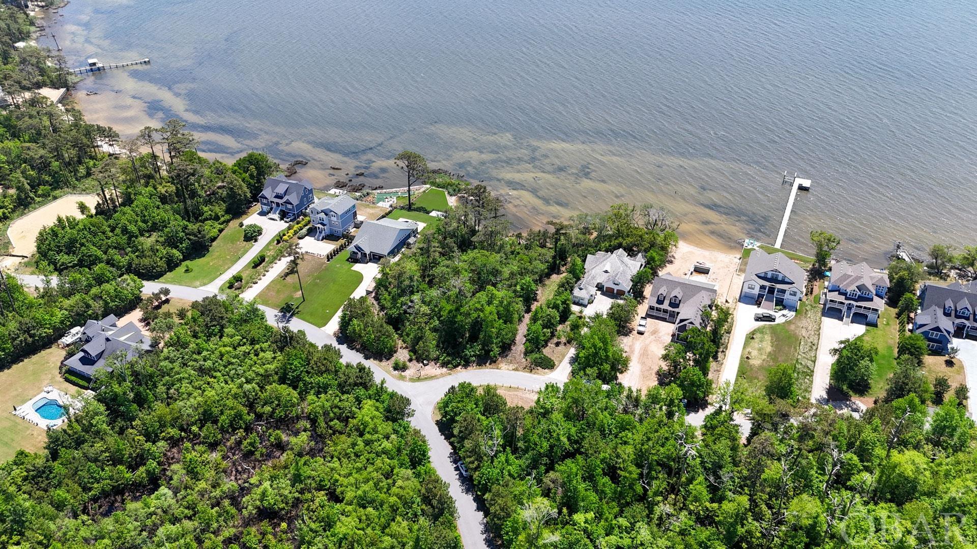 Amazing sound front lot in the Carlyle Community! This large 18,000-square-foot lot would make the perfect location for your dream home. This is located one lot down from the community sound access with amazing views over the Albemarle Sound. The majority of this lot falls in the X -Flood Zone setting you free from the need for flood insurance. Carlyle on the Sound emphasizes the need to preserve the natural foliage of the Outer Banks with 45% of the neighborhood being preserved as open space! Ask your agent about ready-to-build plans for this beautiful lot.