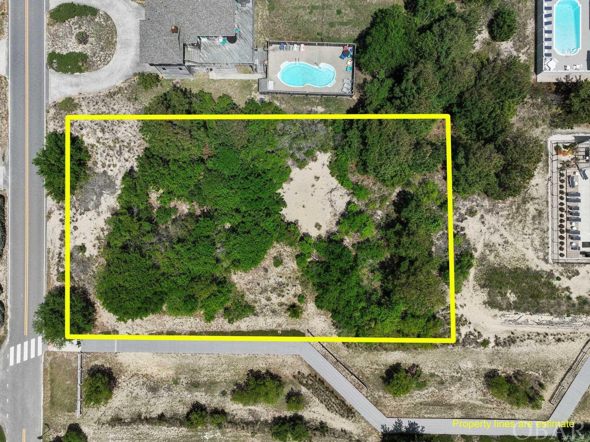 Large, fifth row home site adjacent to the Herring St beach access, a prime location for building your dream home or income producing vacation rental.  Conveniently located for a straight shot to the beach or a quick car/bike ride to the shopping, restaurants and attractions of Corolla.  This X flood zone lot is 22,000 square feet of potential opportunity in one of the most popular neighborhoods of the northern beaches.  Water tap has been paid.