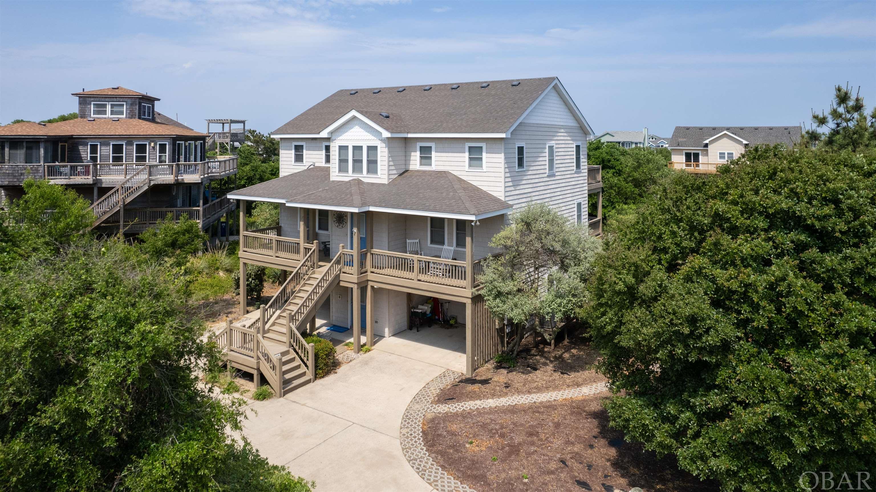 This beautiful property is located close to the beach, has community amenities, and has a quiet, no-traffic cul-de-sac.  Tucked away in the small, desirable community of Port Trinitie, the covered front porch welcomes you into this gorgeous and updated home with an elevator, private pool, hot tub, and large ground-level game and bonus family room.  The floor plan was well thought out and flows perfectly.  A stunning new kitchen with custom cabinetry, artistic backsplash, and quartz countertops opens into the great room.  The top level has tons of natural light and high ceilings.  The biggest ensuite on the top level has a new bathroom with a tile shower, custom vanity, and private laundry, so you don't have to walk downstairs to the larger ground-level laundry room.   The outstanding decor lends itself to the beachy feeling with pleasant bright colors and comfortable accents.  Three of the bathrooms have been completely redone.  The ground level has a large game room and sitting area, a kitchenette, a second refrigerator, and a microwave.  The ground-level ensuite is entirely handicap accessible, complete with a roll-in shower.  Also on the ground level is owner storage and a large laundry room.  Four ensuites are on the mid-level; the larger two have access to the covered deck that overlooks the pool area and beautiful, new bathrooms with custom tile showers. The spacious bedrooms are all accessed by the wide hallway and elevator that goes to all levels.  The homeowners have meticulously maintained and updated this gem!  New light fixtures throughout.  Listen to the ocean from the upstairs sun deck!  Owners have selectively rented through VRBO and have a few weeks booked for the summer of 2024.