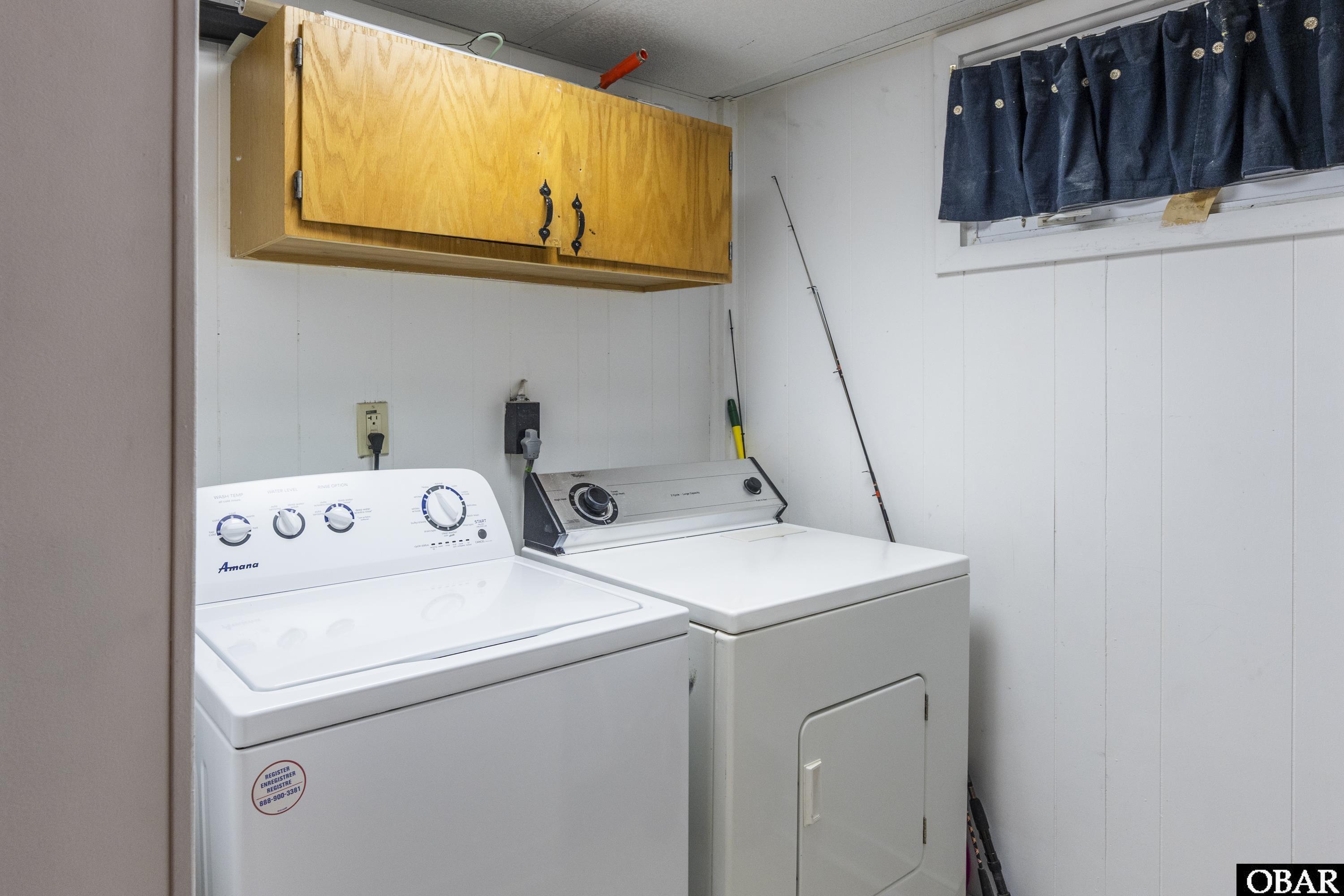 Utility/Storage Room accomodates a full size washer and dryer.