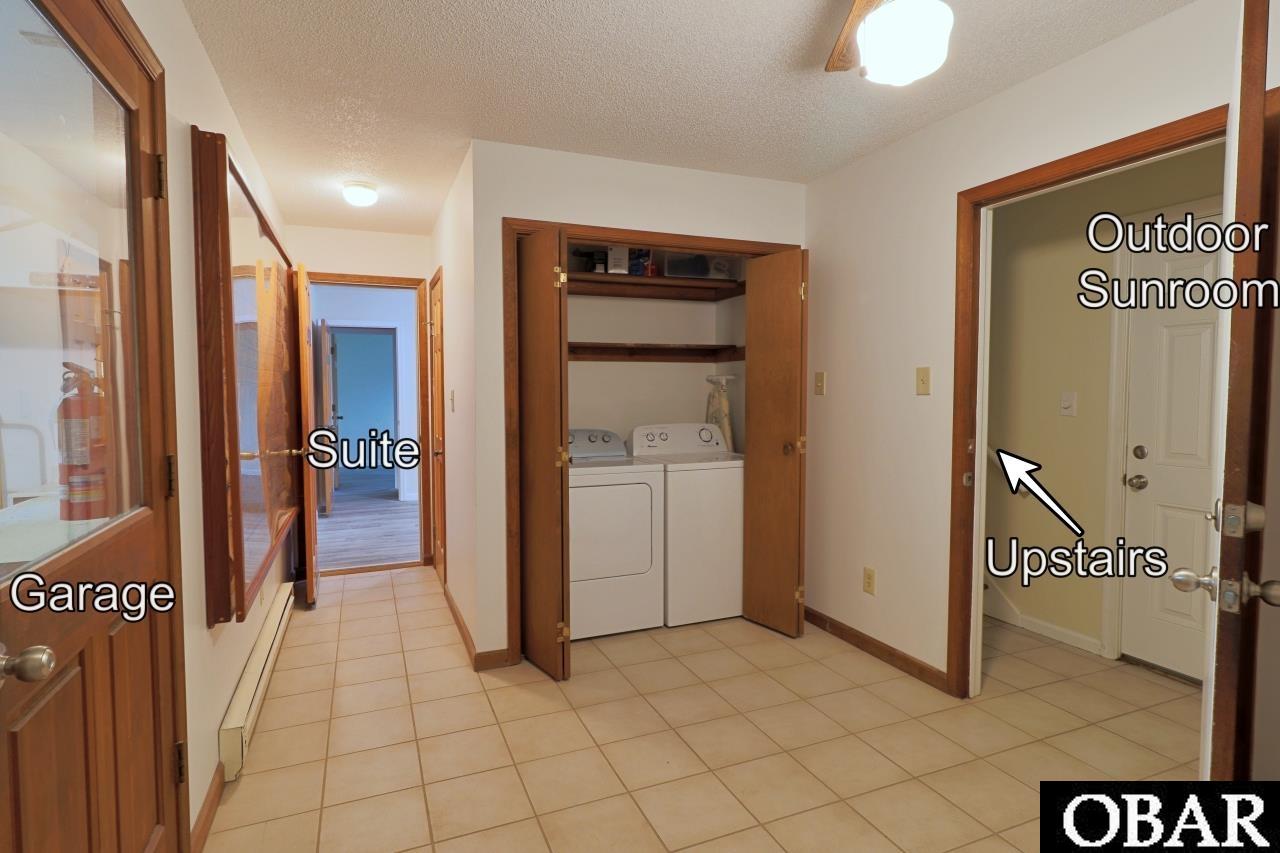 laundry area with access to garage, mother in law suite, or upstairs.