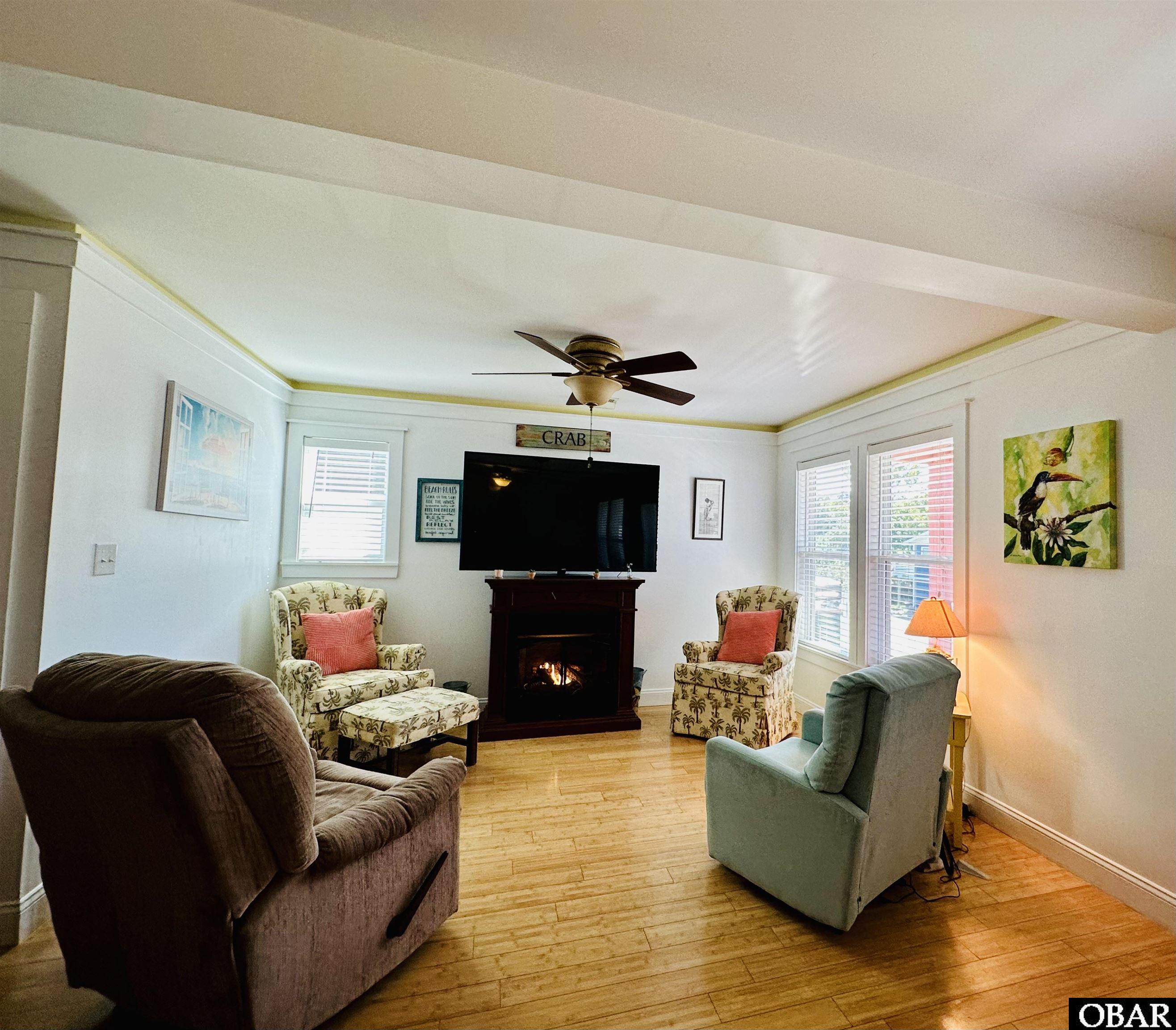 With gas log fireplace on.