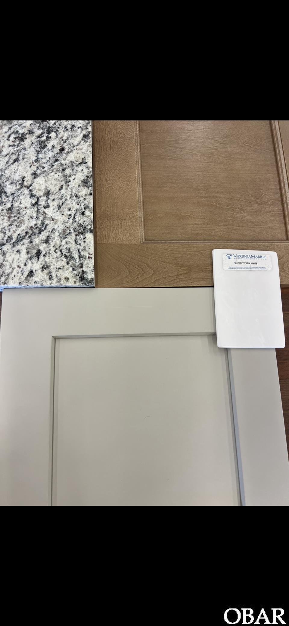 Wood Cabinets will be for the island and the bathrooms with bronze or black fixtures.