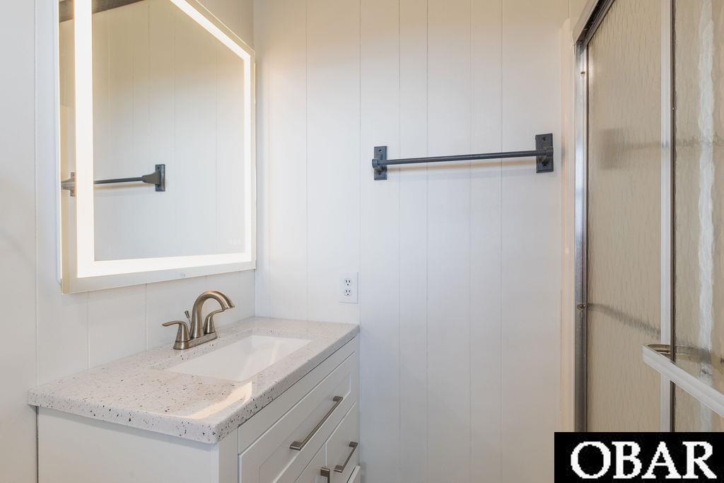 New flooring, fixtures, vanity, toilet and lighting.