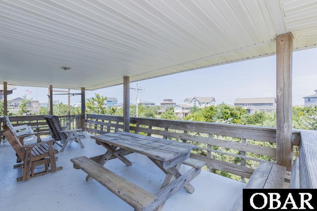 covered porch off main living floor.  Access from living and dining rooms.