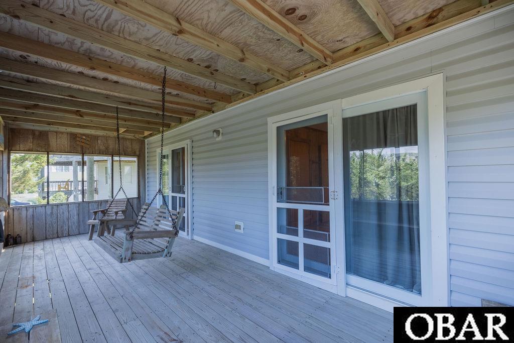 Screened in porch with sliding door access from two bedrooms.