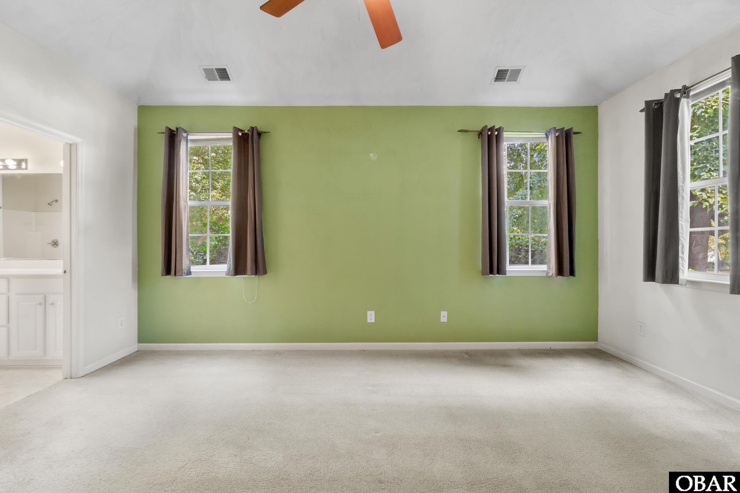 Primary Suite with vaulted ceiling