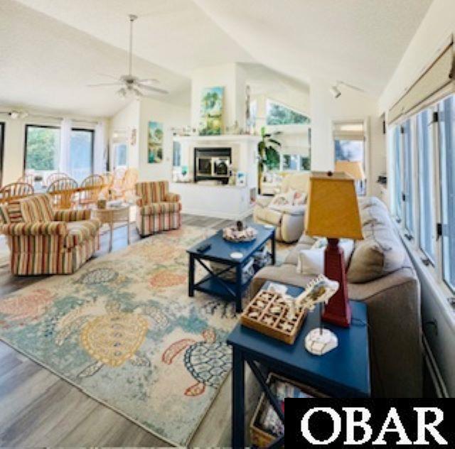 New LVT flooring, large space, lots of windows, sliders, decks, fireplace, built-ins and more.