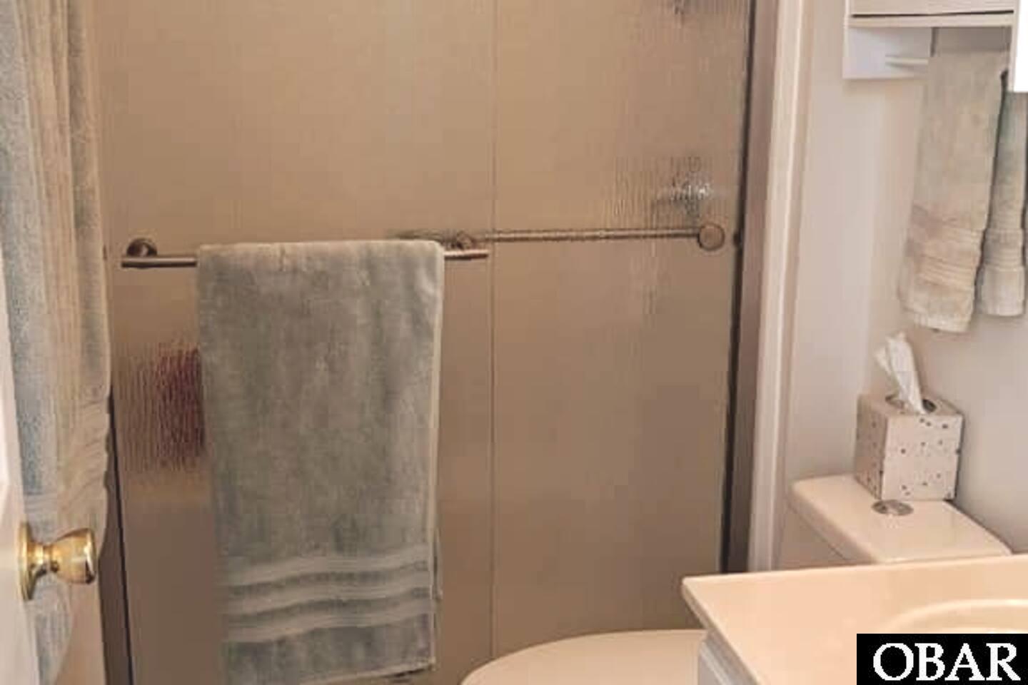 Primary bathroom with single vanity and walk-in shower