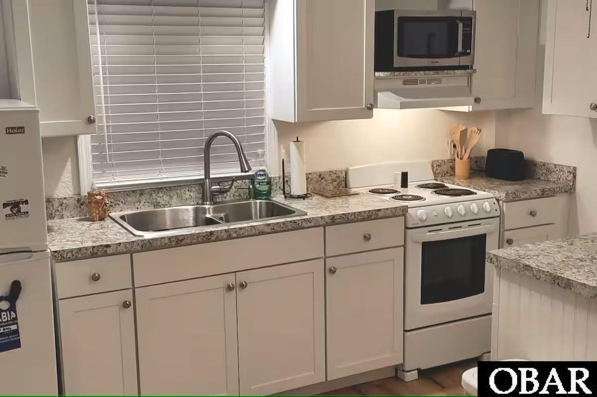 Full kitchen 2 located downstairs. Handicap accessible. Would make a great in-law suite!