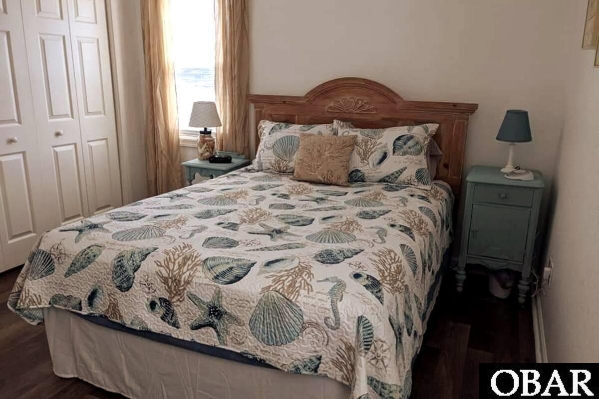 Primary bedroom with attached private bathroom and large closet.