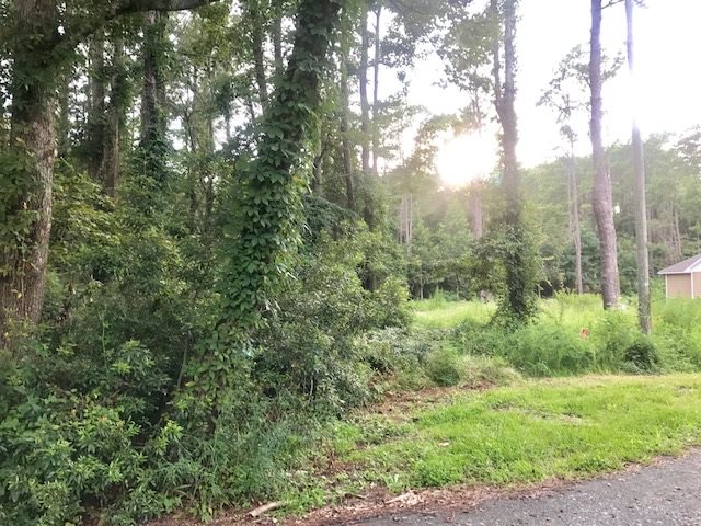 Private, end of street location tucked away in the woods.  Enjoy nearby Nags Head Woods and the central location ease.  Lot next door is also available if you are looking for more space.