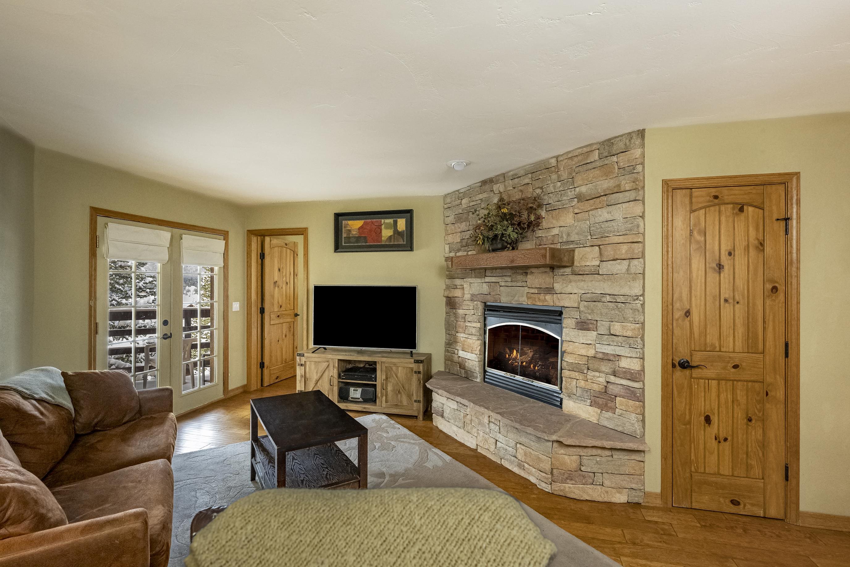 Great Rental Opportunity! Very well maintained 2 bedroom 2 bath condo conveniently located so close the ski basin and the shuttle pick-up/drop-off point. Enjoy a cozy rock fireplace after a long day exploring the many mountain activities Angel Fire has to offer. Stainless steel appliances enhance the kitchen area and wood floors throughout make it easy to keep clean. Solid core doors throughout. Washer and dryer in the unit . Soak in breathtaking mountain views of Wheeler's Peak from the back patio. Fully furnished and ready to book or move-in! High Speed Internet and Satellite TV included in HOA as well as snow removal. This will make a perfect mountain retreat condo.