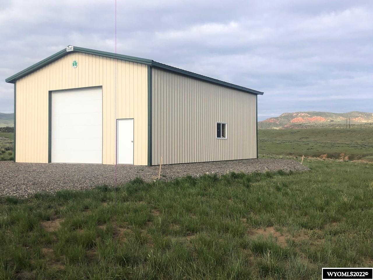 Great corner building lot South of Thermopolis with fantastic views.  New 30' x 40' Cleary shop building with concrete floor already on site, just add your dream house!  Shop has 12' x 12' overhead door as well as walk through door.  Utilities are at property, and include Rocky Mountain Power, city water and sewer, natural gas, and fiberoptic internet.  HOA fees are $100/year for road maintenance.