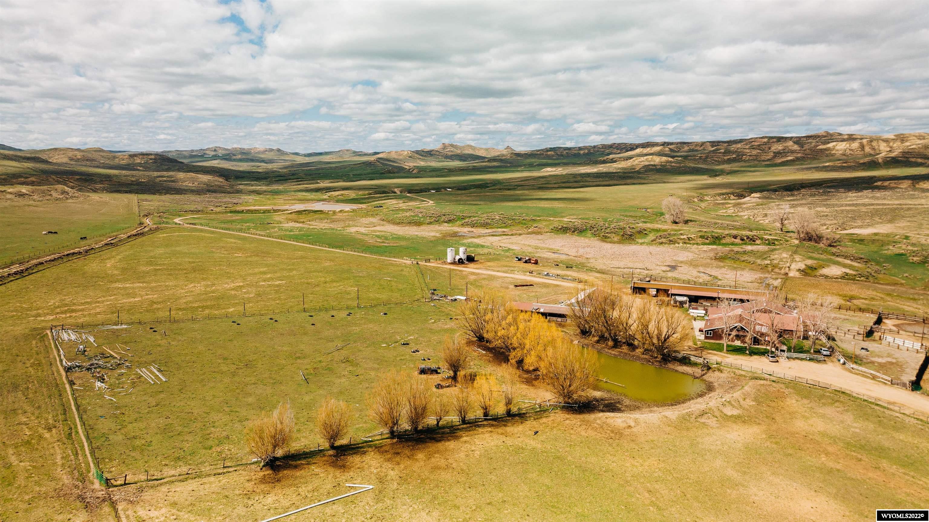 The RBL Ranch in Clearmont, WY encompasses 3187 Acres of deeded ground and approximately 360 Acres of BLM and sits atop 3 major drainages in the Clear Creek Valley offering both large grasslands and rugged sage hills. A network of roadways allow access through the valleys to the ridge tops offering panoramic views of the Clear Creek Valley and the majestic Big Horn Mountains. The topography is varied and elevations range from 3,900 feet to 4,300 feet. The RBL offers exceptionally robust water rights including multiple reservoirs and approximately 1110 acre-feet of Lake DeSmet water from two separate storage pools. Roughly 260 Acres currently under irrigation via 2 center pivots, side roll and gated pipe.  Recent improvements have yielded increased hay production while there remains significant opportunity to expand the irrigated ground. Multiple wells on the property provide stock water by solar or electric power. Formerly a bison operation, the perimeter and interior fences are approximately 5 ½' and all 5-6 strand barbwire. The improvements consist of a well-designed and workable corral system. Corrals are constructed so that shipping operations can occur by use of standard stock trailer or semi-tractor trailers. The RBL offers fantastic hunting opportunities for mule deer, whitetail, and antelope. Deer area 23 & Elk area 129 are both over the counter general areas for residents and antelope area 15 is limited quota draw. The RBL is situated just 45 miles from Sheridan's historic Main Street. The City of Sheridan, Wyoming, a welcoming community of 17,000. Known for its devotion to the arts and western heritage, Sheridan attracts people in search of a small-town lifestyle with the benefits of big-city culture, dining, and boutique shopping. Air Service is available to the community via Denver International Airport with 2 daily flights. The local airport is equipped to handle all private aircraft. Listing licensee is related to Seller.