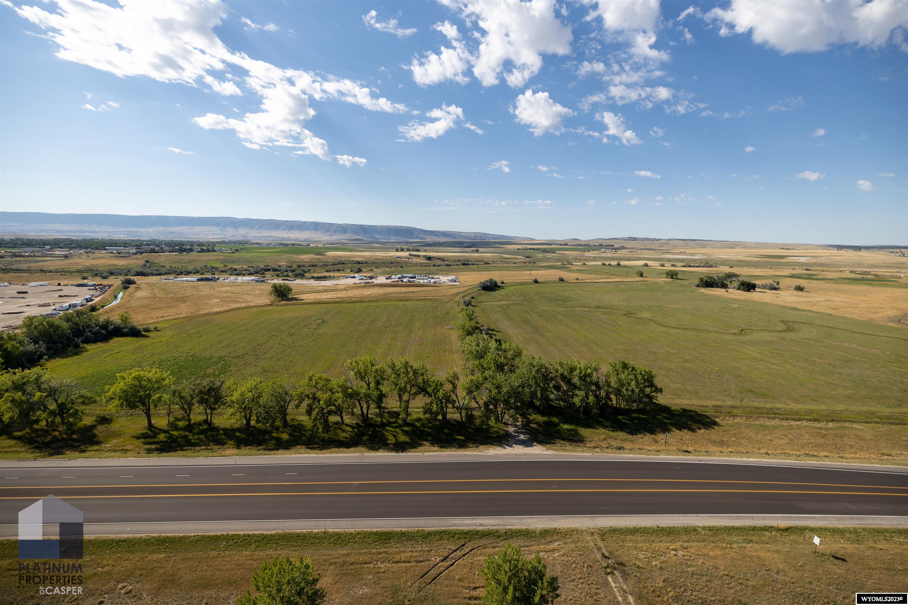 Excellent location with easy access to Highway 20/26 , 4 miles to I-25, right across from Casper International Airport which also has the foreign trade zone and only 8 minutes from downtown Casper. This high traffic location with 280 acres offers endless opportunities with it being zoned light industrial. Electricity is onsite with other utilities running nearby, 400 acre ft of annual water rights. Pre development engineering work has been completed. For more information on this property call Amy Dykes with Platinum Properties of Casper 307-258-8766 or Shae Cady Kimble.