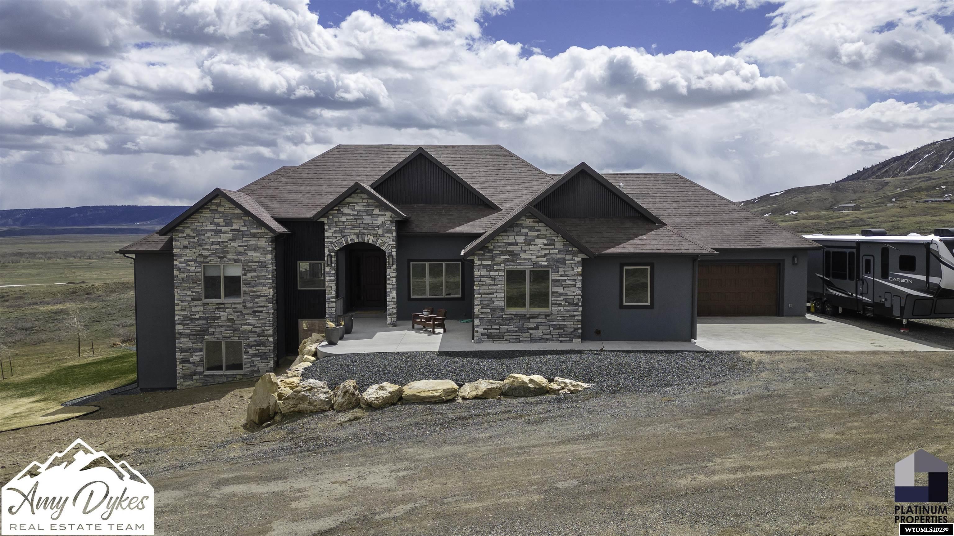 Welcome to your new country home located on the Eastside of Casper on 28.94 acres. This home offers 5 bedrooms plus an office, a bonus room, 4.5 bathrooms, and a 4-car garage. Additional features include vaulted ceilings, a gas fireplace, a luxury master suite, a bar area in the basement, and a walk-out basement with a covered patio. Enjoy entertaining out on the covered deck with breathtaking mountain and its own private well. For more information on this beautiful home call Amy Dykes with Platinum Properties 307-258-8766 or Shae Cady Kimble 307-277-9089.