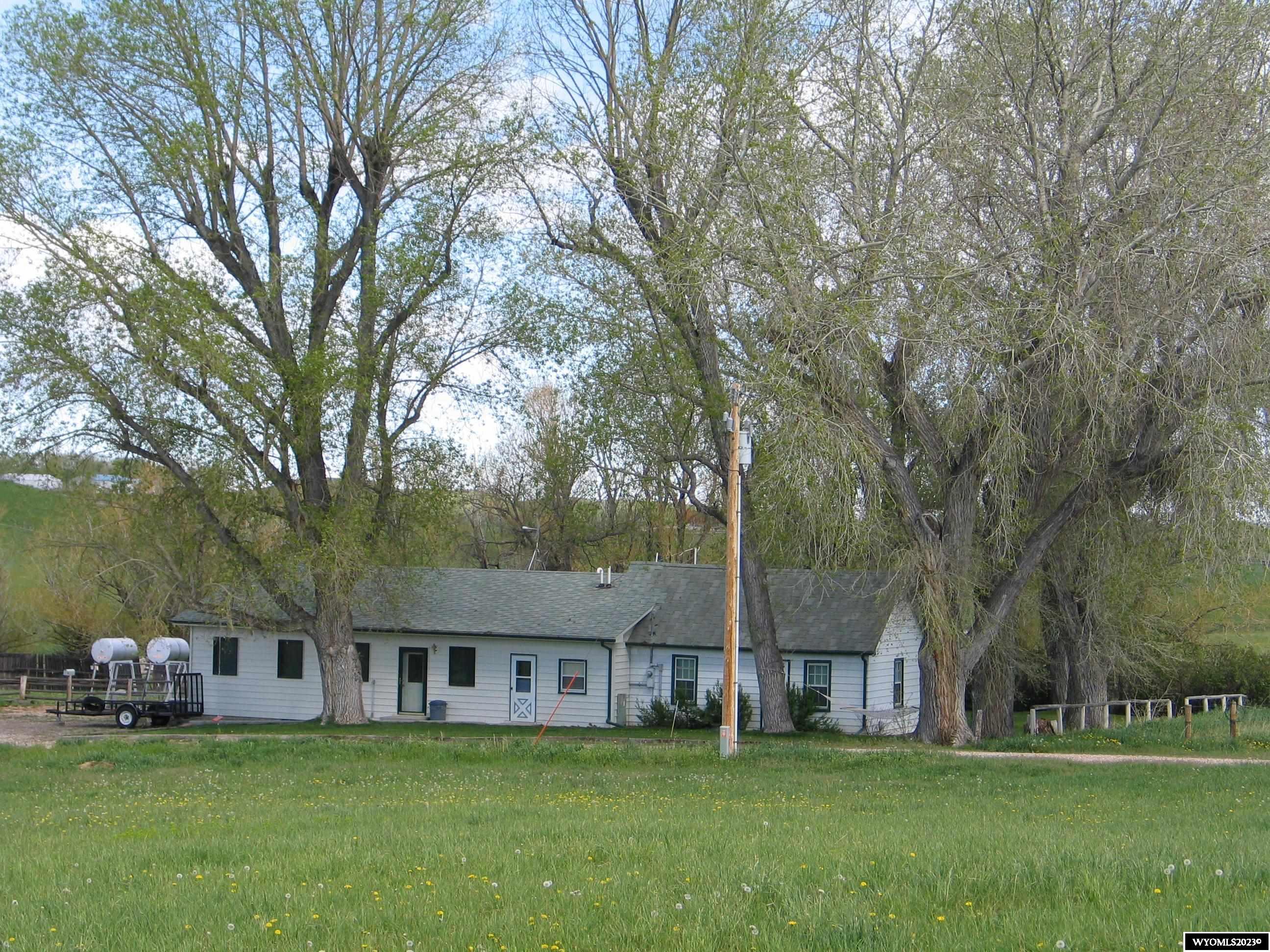 This beautiful 37.3 acre property has 19 irrigated acres and has Rifle Creek running the length of the property that also feeds a stock pond. There are 2 houses on the property. The older home has 2-2bdr/1 bath & 1- 1bdr/1 bath apartments. The upstairs barn apartment has 3 bdrs/1 bath. The 5 elite horse stalls have individual self waterers with doors opening out to outdoor paddock's. Hot/cold wash bay and a heated vet room with washer/dryer.  Detached 3 sided 4 stall shed. Perfect for exercising your ponies