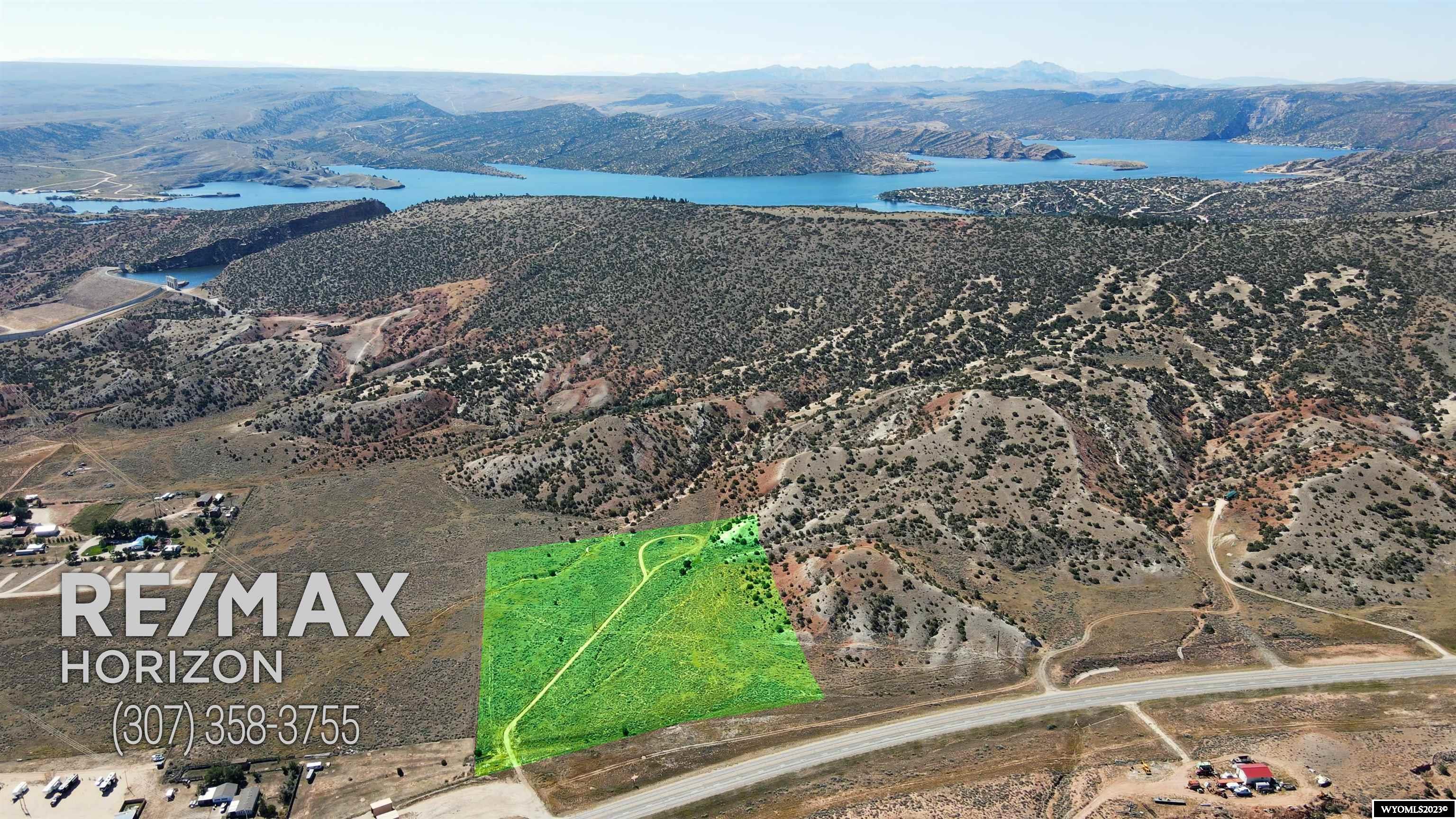 Call Ryan for more information at 307-351-1145! This 12 acre parcel has been re-zoned for commercial use near the town of Alcova! An amazing opportunity awaits the buyer for commercial development near this bustling reservoir! Located with easy access off State Highway 220, many possibilities exist here for development. With year-round access and high-visibility, this property has a lot going for it! In addition, this piece is adjacent to BLM land! Call for more information today 307-351-1145