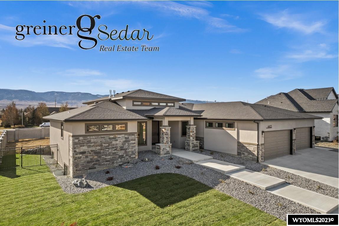 Smooth flowing lines throughout this open soft contemporary designed home.  Built by Casper's premier builder, Eades Construction. This home has everything and more. Stunning mountain views from the moment you walk up to the front door and enter the home filled with majestic views. The beautifully designed kitchen offers top of the line built in appliances, two sink areas, walk in pantry, quartz and Bedrosians Porcelain slab counter tops and 11' ceilings. The flow of the great room along with the kitchen and dining area offers a exciting and lively area for entertaining. The Primary bedroom and bath is an oasis in itself with a spa like bathroom and spacious walk in closet with built in cabinetry and hanging nooks. The bedroom offers the same awesome mountain views. Main floor also has a second suite. Lower level rooms have garden level windows and all three bedrooms have access to their own bathrooms. Spacious family/game room with wet bar, room for a pool table, and cozy area around the fireplace. The exterior has real stone and stucco and the four stall garage is an added plus to this amazing home. No disappointments when you tour this one of a kind home.