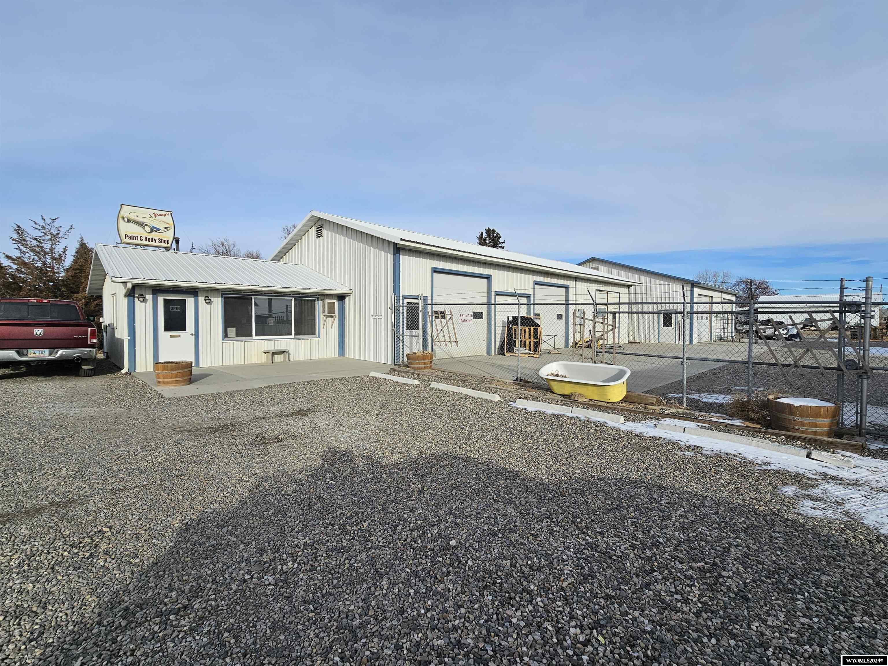 Property is currently used as a body & paint shops. 2 Steel Constructed Commercial Buildings (office area is frame) + 2 Frame Buildings,.  Building #1 has approximately 2270 Sq Ft; included in building is 400 sq ft office space, break room, 1/2 bath.  Shop has 1800 Sq Ft with 3 overhead doors, LED lighting, 3 storage areas and wash bay.  Shop heated with infrared heaters & one bay has air purifier.  70 sq ft attached storage. Building#2 has approximately 1600 Sq Ft with 2 overhead doors. Building #3 is the original south school house in Worland with 760 sq ft being used for storage.Building #4 was the 1st general store in Worland with 624 sq ft being used for storage.  The property may be purchased with all the body and paint inventory & equipment including a paint mixing booth and paint booth for $350,000