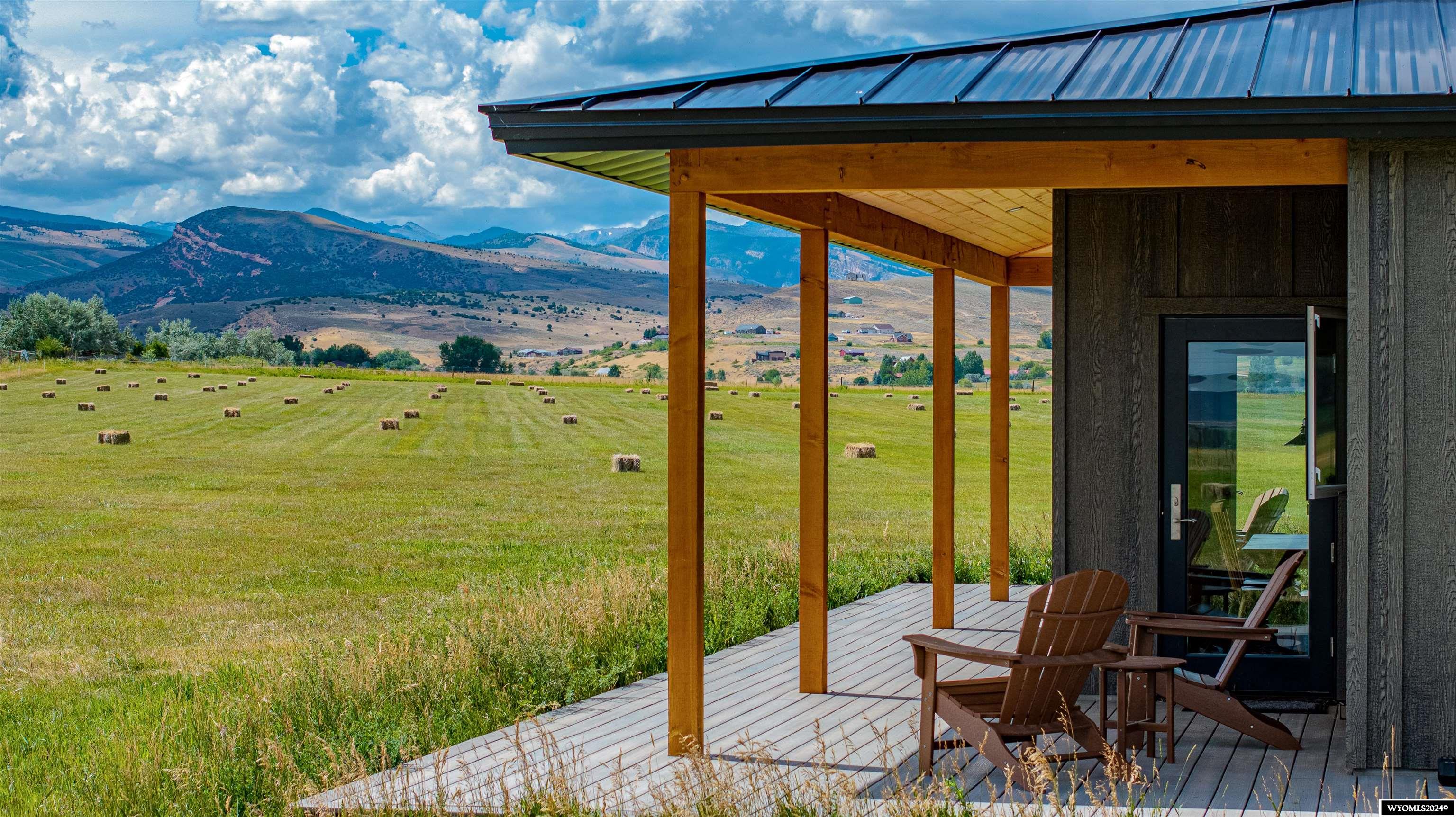 Golden Willow Haven is the quintessential Wyoming horse property. Features include a custom home, 160 x 98 indoor riding arena, 2 loafing sheds with automatic waterers, irrigation, and abundant mountain views in every direction. It is approximately 14.79 acres sitting on the bench above Lander Wyoming, conveniently located just outside the city limits. Amazing care and attention to detail were taken in the design and layout of the home, arena, and property.The home is an oversized 2 bedrooms and 2 bathrooms with an attached 3 car garage. Inside you will find a generous living area coupled with a gorgeous custom kitchen featuring granite countertops and Wolf and Sub-Zero appliances. A dining area offers views second to none in the valley. Passing to the two back bedrooms you’ll traverse a short corridor with a built-in office space containing ample room for two workspaces and entrances to a convenient pantry and second bathroom. Resting between the two back bedrooms is a convenient laundry room with built in wash tub and folding benches. This acts as a mud room and access to the oversized three car garage. The guest bedroom is situated on the west side of the home and has a large picture window for enjoying the amazing sunsets on the Wind River range. A master suite should feel luxurious and this home’s does not disappoint. The warmth of the in-floor heat rises up to meet you in the morning as you awake with the sun out a large east-facing window. The deep walk-in closet is well designed and conveniently located nearest the laundry room. A built-in soaking tub is adjacent to a curb-less, walk-in tile, shower and accompanied by a granite vanity.   Built with incredible craftsmanship and foresight both inside and out, this home features hydronic in-floor heat, air conditioning through exposed ducting in vaulted ceilings, stained and polished concrete floors, a whole home Bluetooth stereo system, and has been prewired for satellite dish or internet. The home is supplied water by two 3000 gal cisterns. Both the home and barn have separate septic systems.  14.79 acres of fertile soil with irrigation rights to the majority of the property, grows a very healthy stand of grass through the summer and makes excellent pasture. Electric fencing is offset from the perimeter and has multiple cross fences for paddocks or rotational grazing.  The property sits on an unassuming plateau looking down on the outskirts of Lander. Unlimited mountain views abound in every direction. Property with this amount of seclusion and close proximity to town are extraordinarily rare in the Lander Valley. The terrain is mostly flat and the parcel is situated and has adequate length that it would be quite convenient to put in a private air strip as well.   An oversized heated 3 car garage was built in accordance with the lifestyle of the property. Each bay can easily house a full-size dual wheel pickup with ample room for storage. The garage is heated with hydronic in-floor heat and one bay is prewired for an electric vehicle charging station.  Approximate size is 28 x 36 feet. To those with horses a barn is often as important as the home, and at Golden Willow Haven it shows. The facility features a 160 x 72-foot arena with slanted kick boards, rubber mulch footing, and a full assortment of jumps, rails, and obstacles. The size is generous for most equestrian disciplines and perfect for 20-meter circles. An Approximately 26-foot-wide section along the arena includes a 1 bed 1 bath apartment, alleyway, tack room, restroom, 2 saddling bays, storage and ample room for covered hay storage. With a building of this size and quality, usage possibilities outside the scope of an arena are endless as well. The barn would be suited as a large hangar for a private airstrip, equipment storage, a mechanic’s shop, a dance studio, or anything else an owner can imagine. The 1 bed 1 bath apartment was recently finished inside and would make a terrific manager’s apartment or g