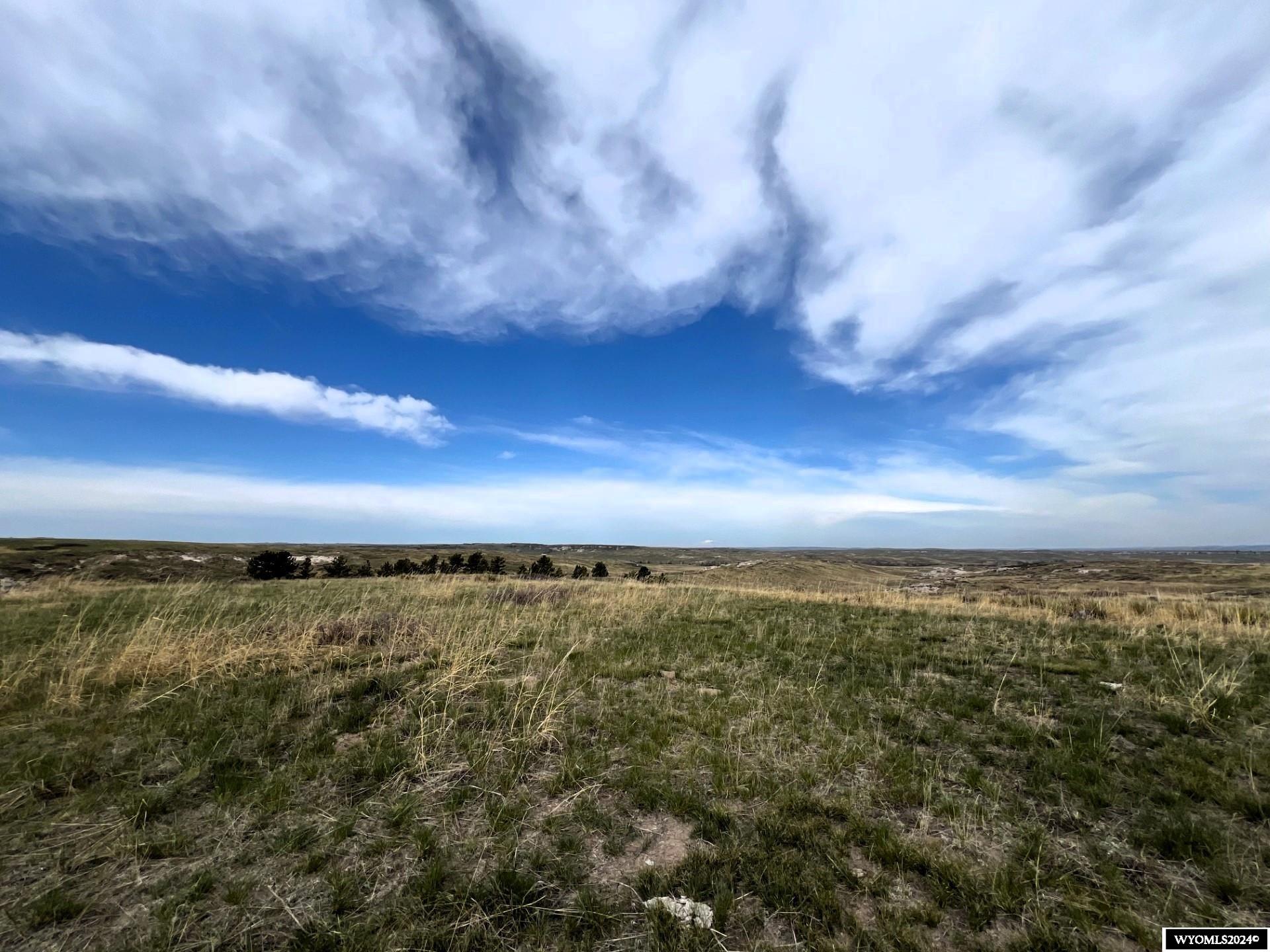 The Smith Ranch on Deer Creek has been family owned for over 50 years. This ranch features 1600 acres of the beautiful, wide-open spaces of Wyoming. This ranch is fenced and cross-fenced. The well is piped to three stock tanks. There is electricity to the old homestead. Deer Creek traverses the west property for roughly a mile where livestock can water freely. Terrain includes flat pastures, rolling hills, and rock outcroppings. Deer, antelope, and other wildlife call this ranch home. There are severalgreat building sites for your dream home with spectacular views of the creek, mountains, and plains.  Located on Road 11, Goshen County, Wyoming, southeast of Fort Laramie. Call Aaron Madsen, 307*331*1846 or Lisa Cochran, 307*331*2325 for details.