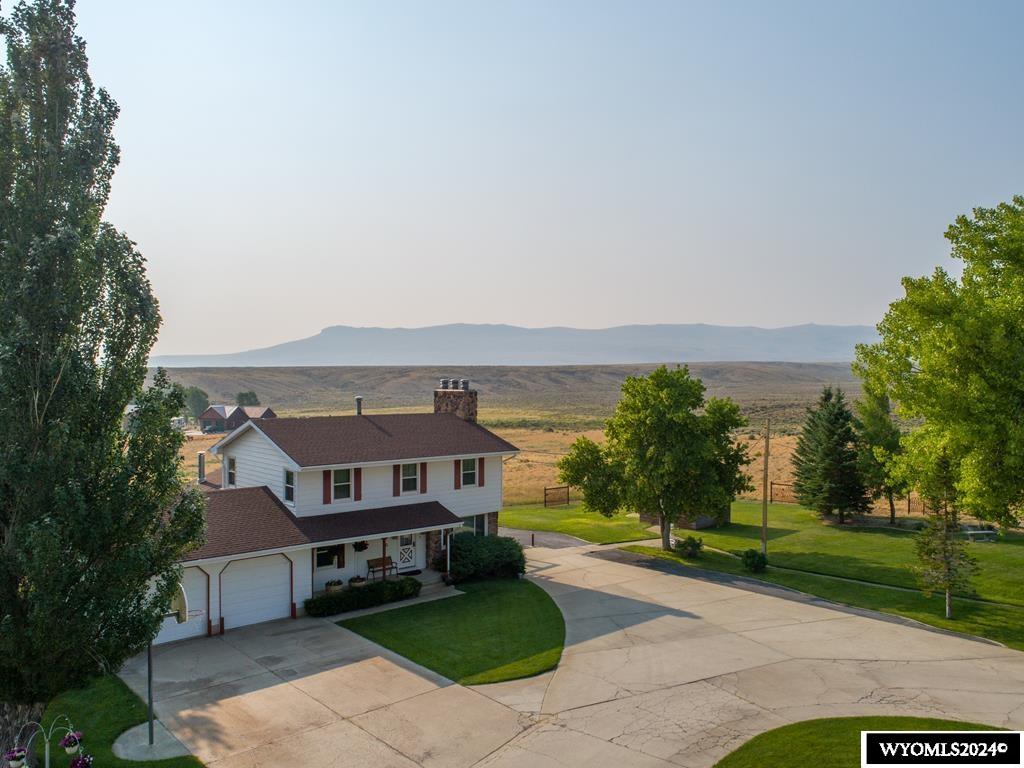 The Kolman Ranch includes the following Amenities with the Sale of the Property:   • 12.85 Deeded Acres with 7 adjudicated water wells.  • The main water well produces 110 gallons per minute with a 5 HP pumping 90 GPM on demand.   • All mineral rights are included in the price.  Detailed Descriptions of the Four Homes Located on the Property19A is the primary residence that is a 3,568 SF two-story steel-sided house with 5 bedrooms, 3 1/2 bathrooms, 4 wood burning fireplaces and a fully finished basement.   19A Details • (4) smart home thermostats  • (4) security cameras  • Schlage keypad locking front door with announcing/intercom door  • Newly installed natural gas heating high efficiency boiler • New luxury steam shower  • High efficiency triple pane windows • 40 gallon hot water heater • Fireplaces in the master bedroom, living room, family room and basement • Large closets and storage areas • Custom-built Oak Kitchen Cabinets • New double oven, microwave and glass cook top • Double door fridge and stainless steel dishwasher • Large reverse osmosis water treatment system   • Custom ducted swamp cooler for upstairs and main floor cooling.  • Large deck with 240 volt wiring for a hot tub • Two car heated garage with large pantry and storage with extra fridge and freezers.  New overhead insulated doors with windows • Custom-built office cabinetry   19B 19B is 696 SF with 2 bedrooms, 1 bathroom, living room, kitchen, and sunroom. This 1970 Marlette home is on a permanent foundation. Forced air furnace with a wood burner stove. All appliances with washer and dryer  included.   Currently rented for $950.00 per month.  19C 19C is 1,000 SF framed home with 1 bedroom, 1 bathroom, large living room, kitchen, and attached heated car garage. 19C is a renovated Union Pacific that is well insulated home on a permanent concrete foundation. Heated with natural gas wall furnaces. All appliances with washer and dryer included.   Currently rented for $900.00 per month.  19D 19D is 1,280 SF with 3 bedrooms, 2 bathrooms, living room and kitchen. This 1985 Westpark home is well insulated and heated by natural gas forced air and highly efficient wood burning stove with a swamp cooler for summer use. All appliances with washer and dryer included.  Currently rented for $1,250.00 per month Detailed Descriptions of Additional Buildings and Amenities Located on the Property  Brick Pump House with original water well. 110 GPM water well is piped in from the southwest corner of the property. Grunfos CU3315P 5 HP Submersible Pump capable of 90 GPM.  Onan/Kohler Auxiliary Electric Generator supplies power for water pump and 19A & 19B when Rocky Mountain Power fails. Natural Gas supplied.  North Star Ultra Water Softener supplies all the buildings with soft water. 2 Culligan water filters. (Also, one in 19A home)  Sprinkler System consists of 16 Zone Rain Bird controller with 14 zones in use.  The Main Water Well location is lighted in a 12 foot deep galvanized inverted culvert with insulated deck flooring and capped with a large fiberglass cover.  Brick Slaughter/Butcher Shop which has its own water well and piped in water from the main system. Natural gas availability for heating and water tank. Steel rail track and pulley to hoist animal carcasses for cleaning and butchering.  Small steel sided Children’s Play House with swings, monkey bars, and slide.  Metal Storage Shed currently designated for flammable materials (oil and gas).  Brick Machine Shop with storage cabinetry and shelving.  Parking for three vehicles.  Heated with a natural gas overhead furnace. Water faucet and drain sump in place. 240 volt power for welding. Fluorescent overhead lights. Electric garage door.  Second Metal Storage Shed is available for use for additional storage.  Northwest Brick Storage Building is primarily used for renter’s storage. Water is also available in a faucet.  Large Brick Cattle and Hay Barn is pri
