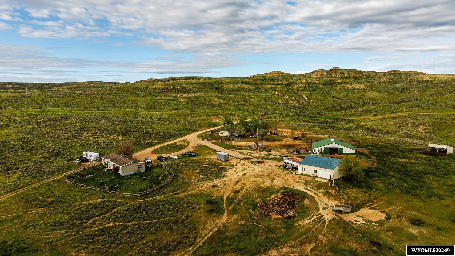 This ranch has it all! It offers 769 +/- acres of privacy and plenty of room to roam. Featuring a 2-bedroom, 2-bathroom home, a 1200 sq ft barn, and a 2394 sq ft shop. One can enjoy the mountain views and wildlife, such as mule deer, antelope, and upland game birds. Thompson Creek runs through the property as well as stock ponds. It is fully fenced and cross-fenced with multiple stock tanks. This property is waiting for your livestock, animals, and toys.Don't miss out on this rare opportunity! Property is being sold As-Is Where-Is. Acreage/House can also be purchased separately. See MLS #24-629, 24-630, and 24-631. All measurements are approximate.