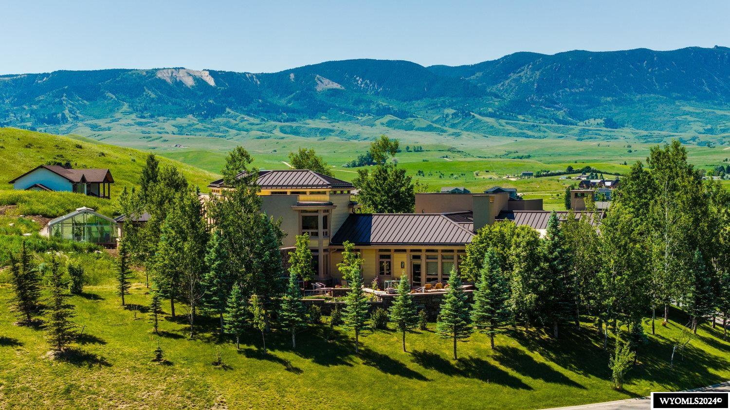 Nestled near the vibrant western town of Sheridan Wyoming, Lion Dog Estate boasts 360 degree views of the Big Horn Mountains while overlooking the magnificent Powder Horn Golf Club. The Prairie Mountain design offers 7500sq ft of spacious living, with thoughtful design given to light, and function, spectacular views display as works of art out every window. No Detail was overlooked in this truly one-of-a-kind custom home. Featuring a gourmet kitchen, bamboo floors, home sound system, radiant heat,a Lutron automatic shades, steam shower, exquisite master suite, stylish dual offices, private guest quarters, library, 4 outdoor entertainment areas, waterfall, and state of the art green house and music room.  Turn the key, walk through the door, this home is all you want and more!