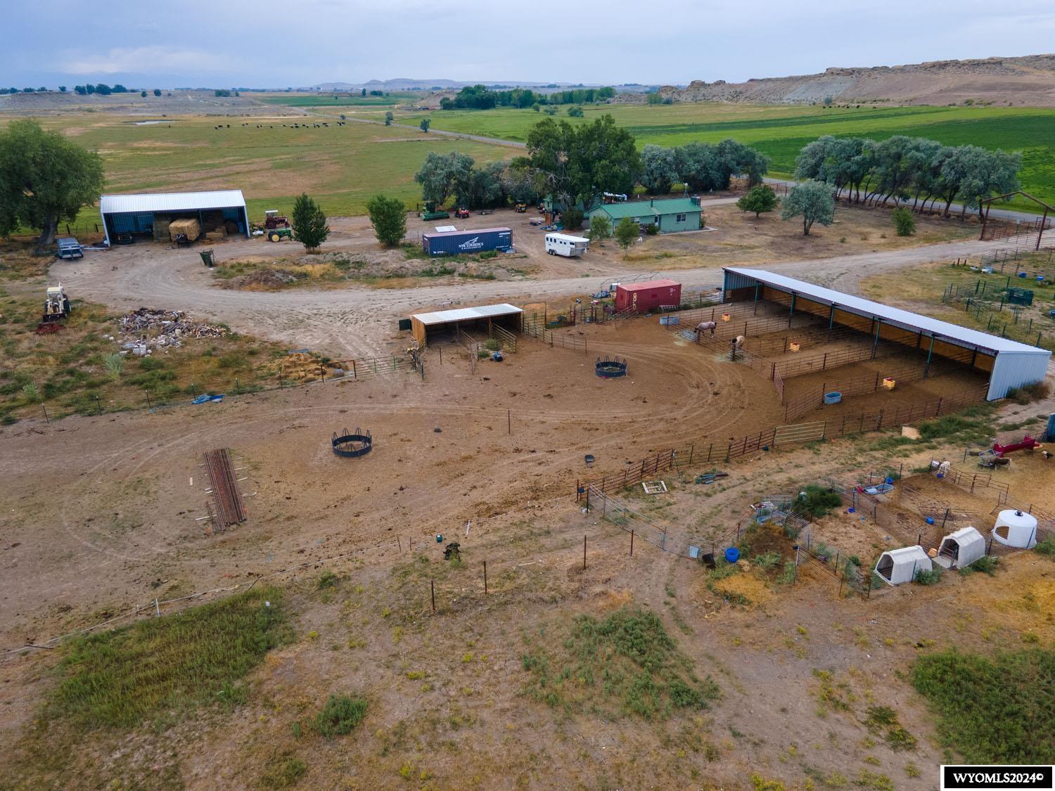 Nestled in the heart of Wyoming's picturesque Fremont County, this farm spans just over 80 acres and has 62.5 acres of Midvale irrigation rights. The property features a charming 2-bedroom house with the perfect blend of rustic charm and modern comfort, making it ideal as a farmhouse for the property. It has updates, too - like a brand-new permitted septic system!  The farm has a large hay barn and a spacious three-sided horse barn. A heated goat barn and a chicken coop add to the farm’s versatility. There is electricity to the sheds for convenience, and a two-car garage with an integrated workshop provides a space for all your projects.  You'll find mature trees on the property that provide shade and add to the tranquil setting. The land produces a reliable hay crop that can serve as an additional income source or feed for livestock. But one of the most striking features of this property is its breathtaking panoramic views of the Wind River Mountains, a constant reminder of the beauty of this area!  Located within the Wind River School District, this farm is ideal for seeking strong educational opportunities in a close-knit community.  This property offers a rare chance to own a farm in a prime location, whether you want to expand your agricultural ventures or simply enjoy a peaceful rural lifestyle. Note this property is in Pavillion, Wyoming. It is approximately 25 miles from downtown Riverton.  Don’t miss out on making this farm your own! Call Wind River Realty at 307-856-3999 to schedule a private showing today!