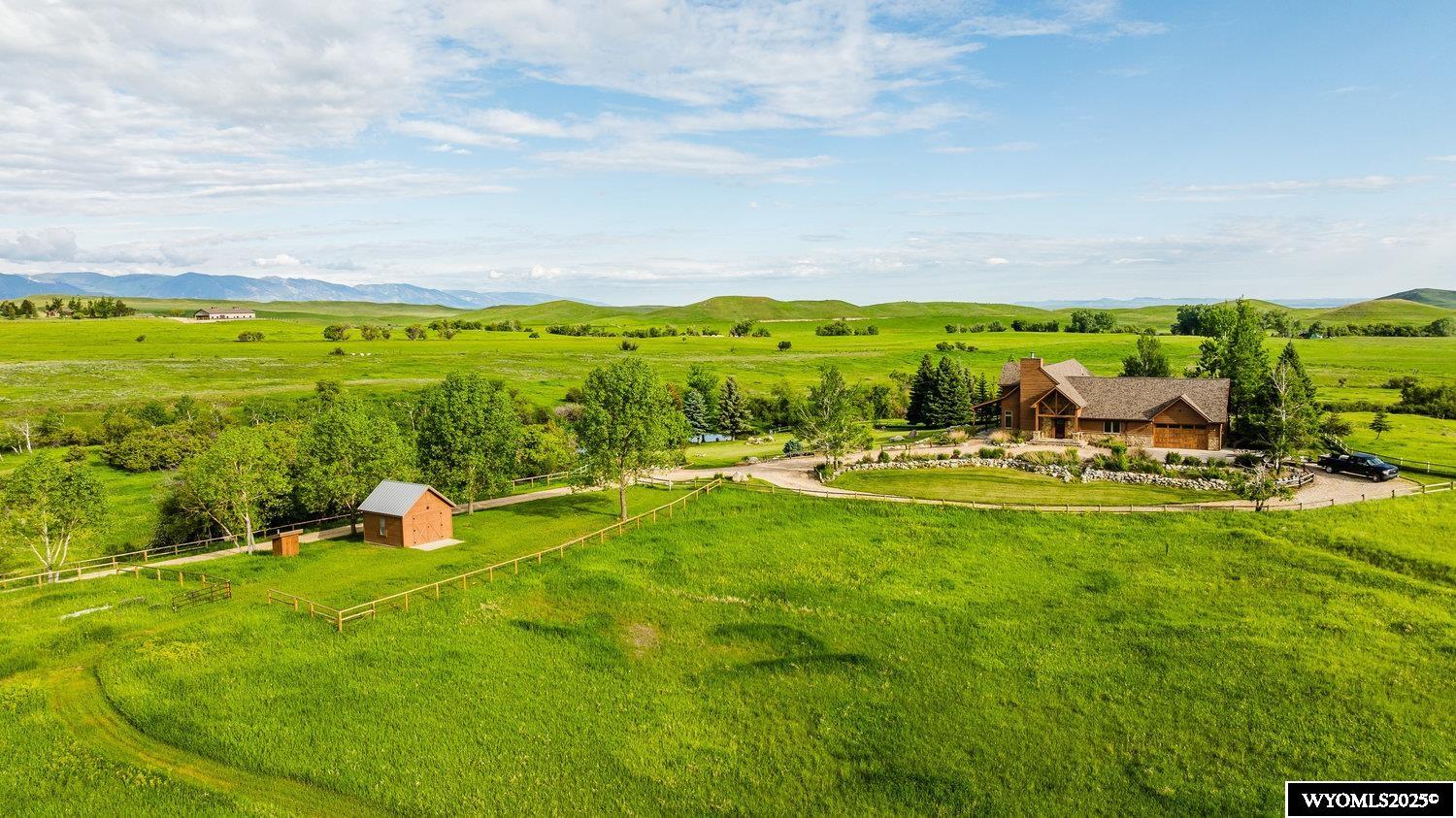 The Meade Creek Equestrian Ranch is steeped in Western tradition. It consists of 45±acres with a meandering creek approximately 12 miles from Sheridan. The ranch includes a beautiful main home within walking distance to a private fishing pond and a well placed storage shed. Walking paths throughout the ranch lead between manicured grounds and expansive pastures, offering stunning views of the Bighorn Mountains. The area is known for both large and small ranches in strong ownership which have created a productive agricultural community. Recreational opportunities such as hiking, fishing, and hunting are combined with polo pony training in the Big Horn area. Three miles from the ranch, world-class polo can be seen all summer as it has for 100 years. A combination of beauty, strength, and history has made this area a sought-after location for like-minded individuals and families.