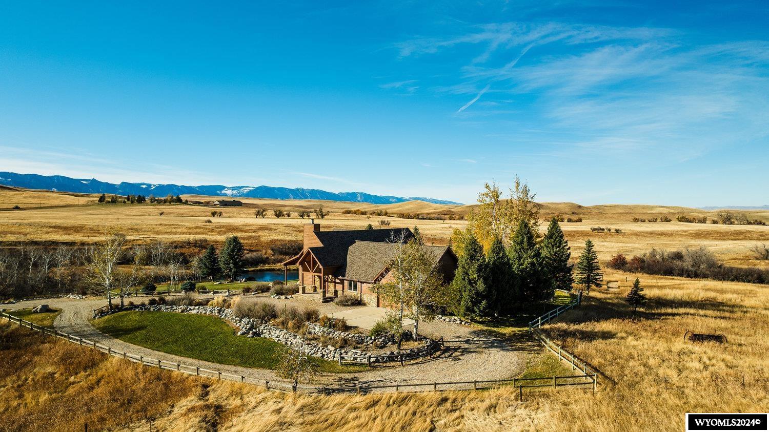 The Meade Creek Equestrian Ranch is steeped in Western tradition. It consists of 45±acres with a meandering creek approximately 12 miles from Sheridan. The ranch includes a beautiful main home within walking distance to a private fishing pond and a well placed storage shed. Walking paths throughout the ranch lead between manicured grounds and expansive pastures, offering stunning views of the Bighorn Mountains. The area is known for both large and small ranches in strong ownership which have created a productive agricultural community. Recreational opportunities such as hiking, fishing, and hunting are combined with polo pony training in the Big Horn area. Three miles from the ranch, world-class polo can be seen all summer as it has for 100 years. A combination of beauty, strength, and history has made this area a sought-after location for like-minded individuals and families.