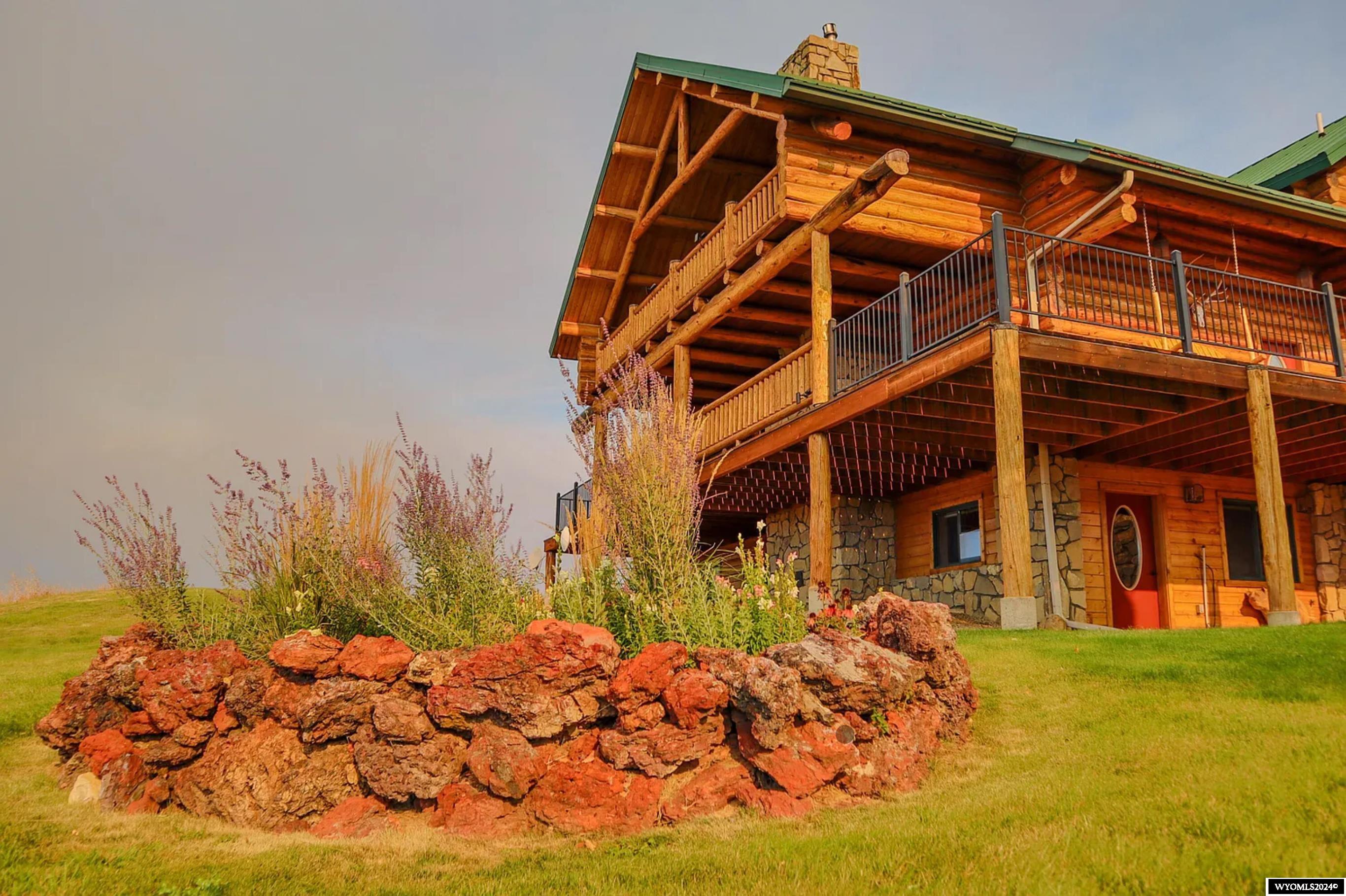 The Rocknhat Ranch epitomizes the Sheridan, Wyoming small ranch experience. With huge, unobstructed views, and at just over 43 acres, this meticulously maintained equestrian property, adjacent to over 7,260 acres of Wyoming State Land, is just a little over 7 miles southeast of downtown Sheridan, Wyoming- one of the premier lifestyle destinations in the American West. Offering the best of the West, this compact agricultural property has a beautiful, custom log home; excellent irrigation that includes 25 shares of stored Kearny water for irrigation anywhere on the property, plus 30.7 acres of adjudicated water rights; a roping arena and round pen with sand, and indoor arena with tack room; fabulous views of the Bighorn Mountains, and an amazing large outdoor recreation area of Wyoming.