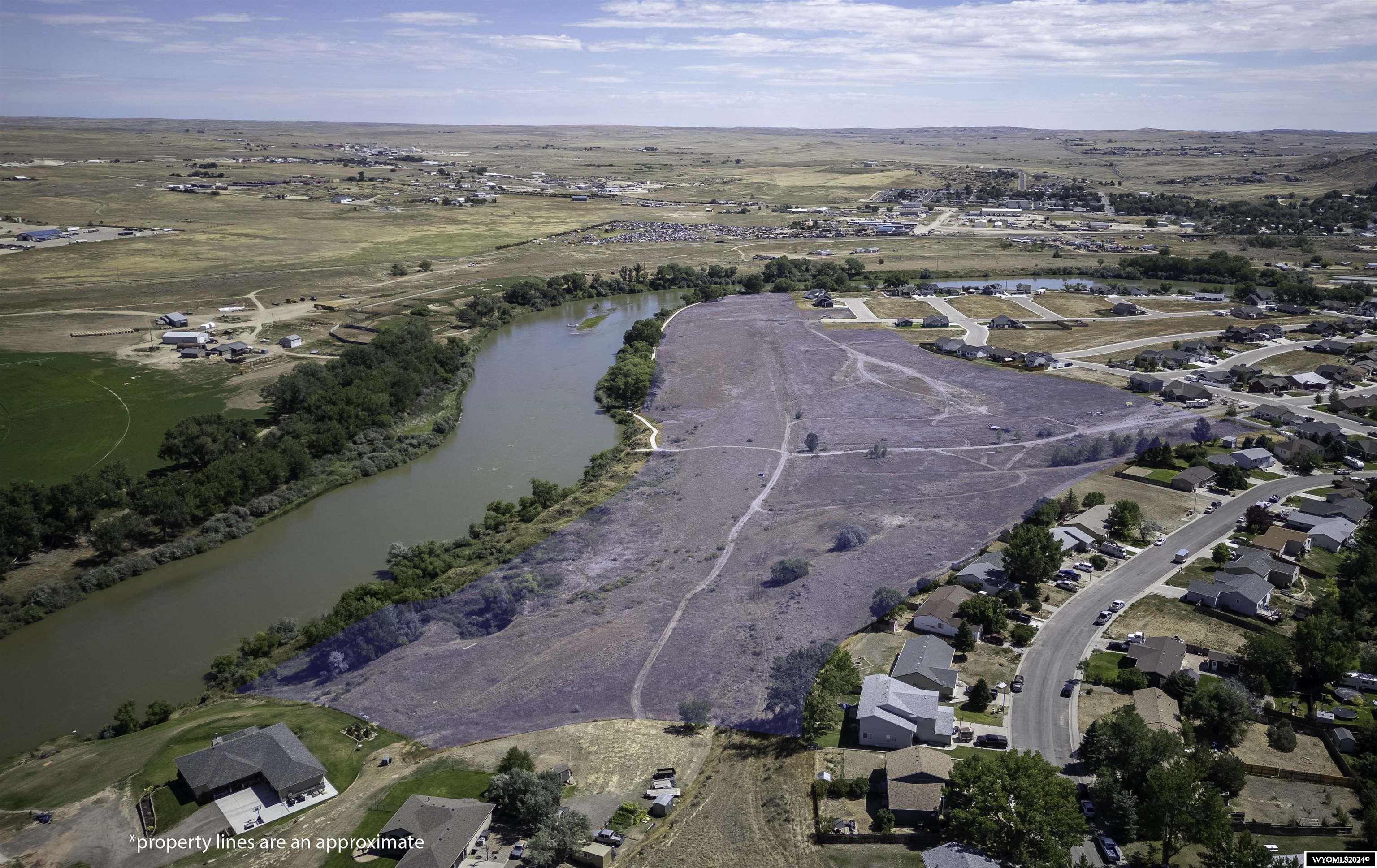Rare opportunity to own over 30 acres on the Platte River in Douglas Wy.  Water, Sewer, gas and electric are stubbed to property.  We have current bids to do infrastructure as it is platted right now for potential buyers to view.  There are multiple opportunities to develop this property as you see fit.