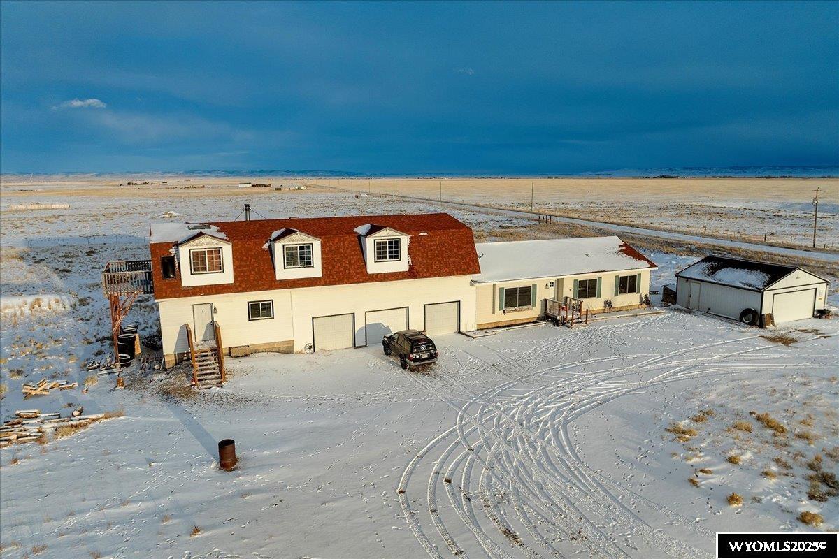 Introducing 16 Mortensen Ln, Laramie, WY - A Unique Ranch Retreat   Nestled on 9.55 acres, this extraordinary property boasts breathtaking views of the Wyoming skies and surrounding landscapes. With over 5,000 sqft of living space, this single-unit residence features natural wood trim, Anderson windows, and an attached heated 3-car garage.   Perfect for animal lovers, this property is set up for horses or livestock, with ample space for corrals, barns, or other outbuildings. Plus, with no covenants, you have the freedom to use your land as you see fit.   Additional features include:  - Detached 2-car garage for extra storage or workspace - Private well with potable water - Carbon County electric and Walden gas - Paved and maintained roads - Breathtaking views of Wyoming skies and surrounding landscapes - Nearby access to multiple lakes, including Mortensen Lake, Meeboer Lake, Lake Hattie, and Twin Buttes Lake - Abundant hunting opportunities in areas 45 (antelope), 76 (deer), and 9 (elk) - 9000 acres of state land and 1700 acres of US forestry land nearby, perfect for hiking, fishing, and exploring   While this property is turn-key and ready for immediate occupancy, it also offers room for improvements and customization within the unfinished basement.  Don't miss this rare opportunity to own a piece of Wyoming paradise.