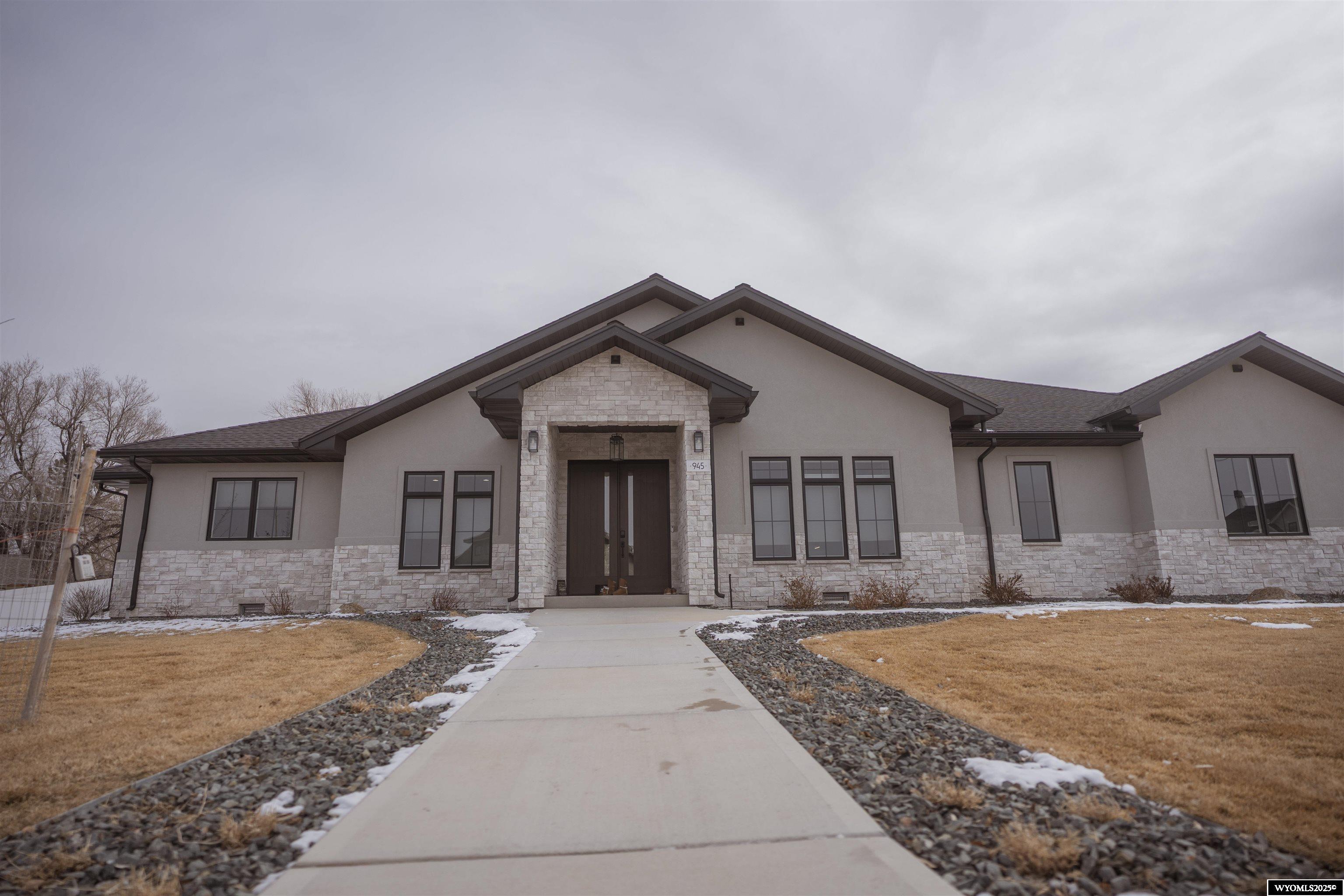 This STUNNING 3,701 sqft modern home sits on a spacious private well irrigated .75- acre lot, offering a perfect blend of comfort, style, and technology. With 3 generously sized bedrooms and 3.5 beautifully appointed bathrooms, Butlers/Large Walk-in pantry, Heated Bathroom Floors and heated 3 car garage with Mud room.  This spectacular home provides ample space for both relaxation and entertainment. The home features an integrated sound system that enhances the ambiance of every room, while the state -of-the-art security system ensures peace of mind. Large windows flood the home with natural light, and open concept living spaces flow seamlessly from one to the next, highlighting high- end finishes and contemporary design elements.  Outside, the expansive lot offers plenty of room for outdoor activities, surrounded by lush landscaping that compliments the homes sleek, modern aesthetic. This is the perfect retreat for those seeking luxury, convenience, and innovation.