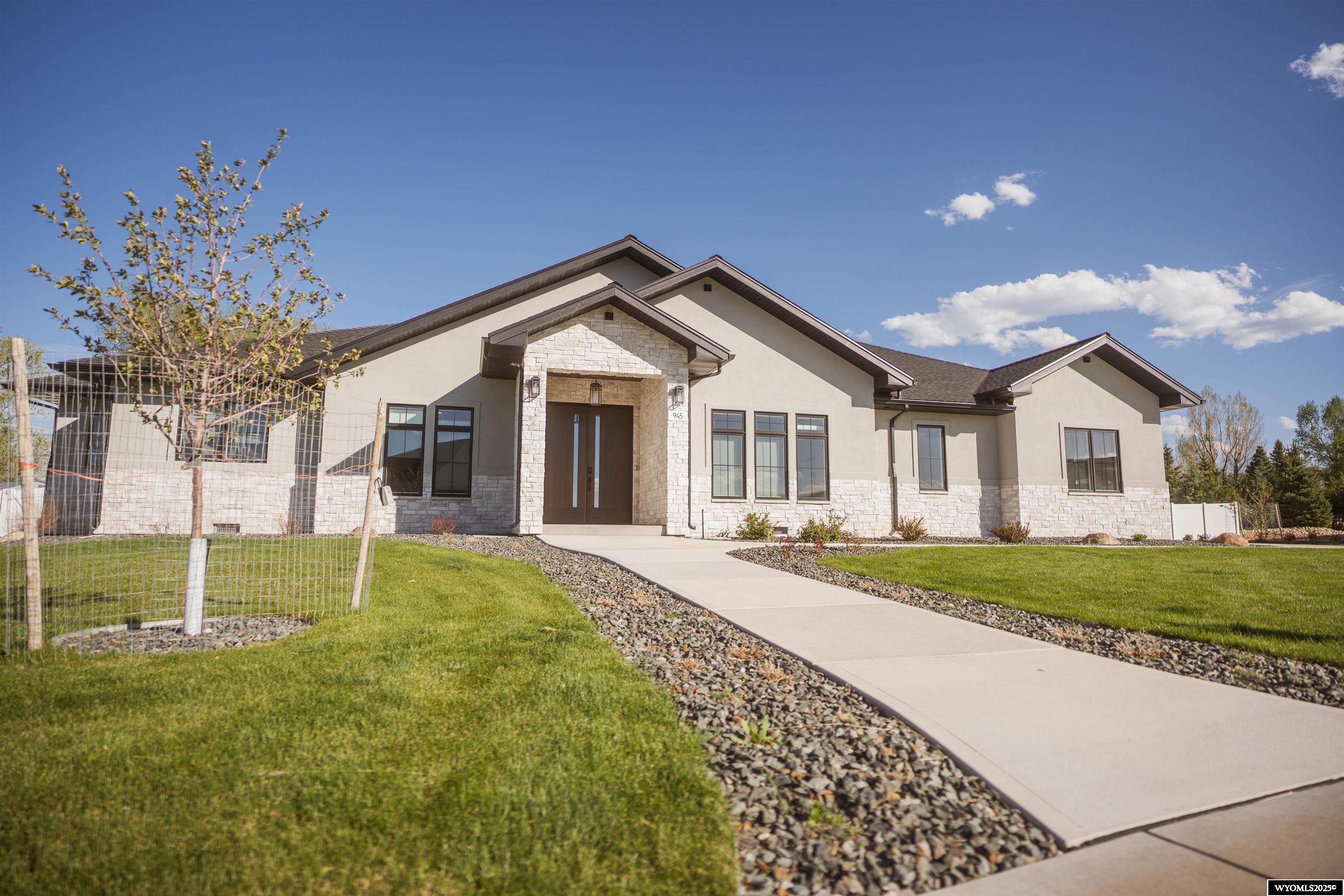 This STUNNING 3,701 sqft modern home sits on a spacious private well irrigated .75- acre lot, offering a perfect blend of comfort, style, and technology. With 3 generously sized bedrooms and 3.5 beautifully appointed bathrooms, Butlers/Large Walk-in pantry, Heated Bathroom Floors and heated 3 car garage with Mud room.  This spectacular home provides ample space for both relaxation and entertainment. The home features an integrated sound system that enhances the ambiance of every room, while the state -of-the-art security system ensures peace of mind. Large windows flood the home with natural light, and open concept living spaces flow seamlessly from one to the next, highlighting high- end finishes and contemporary design elements.  Outside, the expansive lot offers plenty of room for outdoor activities, surrounded by lush landscaping that compliments the homes sleek, modern aesthetic. This is the perfect retreat for those seeking luxury, convenience, and innovation.