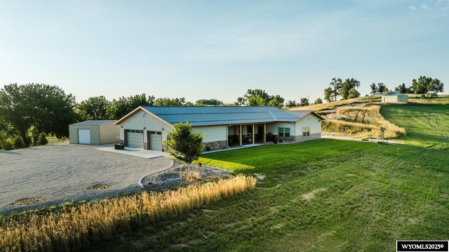 Enjoy the perfect combination of privacy, space, and convenience with this 4 bed 2 bath ranch home situated on 14 acres of picturesque land. Featuring a gated driveway, breathtaking mountain views, an outdoor patio equipped with a built-in-grill and refrigerator, a luxurious walk-in shower. Efficiently maintain the property's landscape or agricultural pursuits with the included side roll irrigation system, designed for easy operation and optimal water distribution. This exceptional property provides an unparalleled opportunity to own a private sanctuary with modern comforts and natural beauty. Don't miss your chance to make this dream home your reality!
