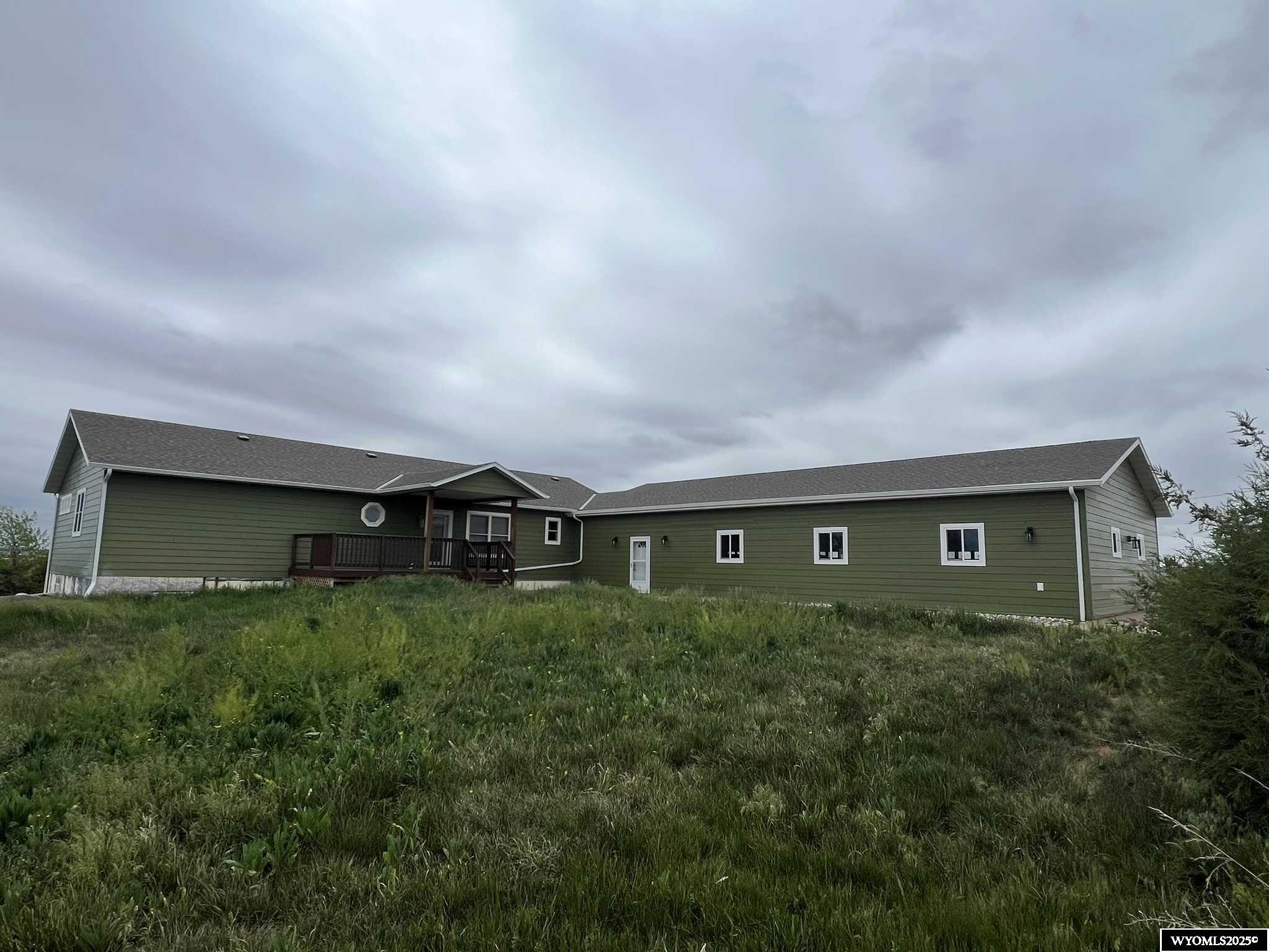 Nice ranch style home on 10 acres just minutes from town. It features a 4 car attached garage and an equipment shop. Amenities include a beautifully remodeled master bath, central air, and new siding. Seller is still in the process of doing some remodeling prior to any closing. Call Jerei Krejci for more information or a showing at 307-351-2083.
