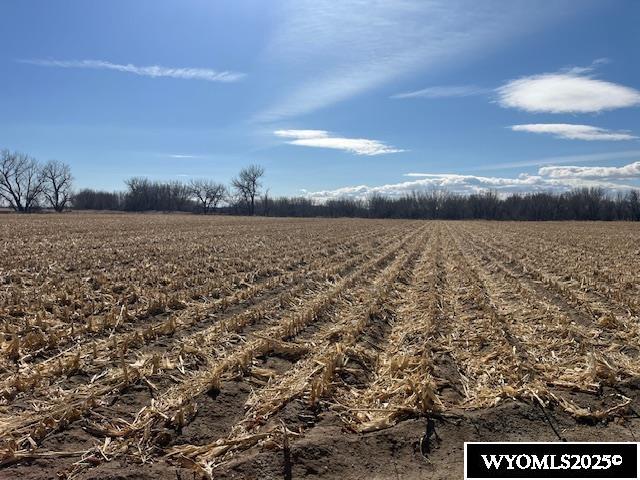 Nice valley farm that joins the railroad and North Platte River. Total acres 125.3, with 110 acres being farmed a crop share lease.  2 irrigation wells, 2 Valley sprinklers.  Abundant hunting on this property.  Farm is currently leased for the 2025 crop season.