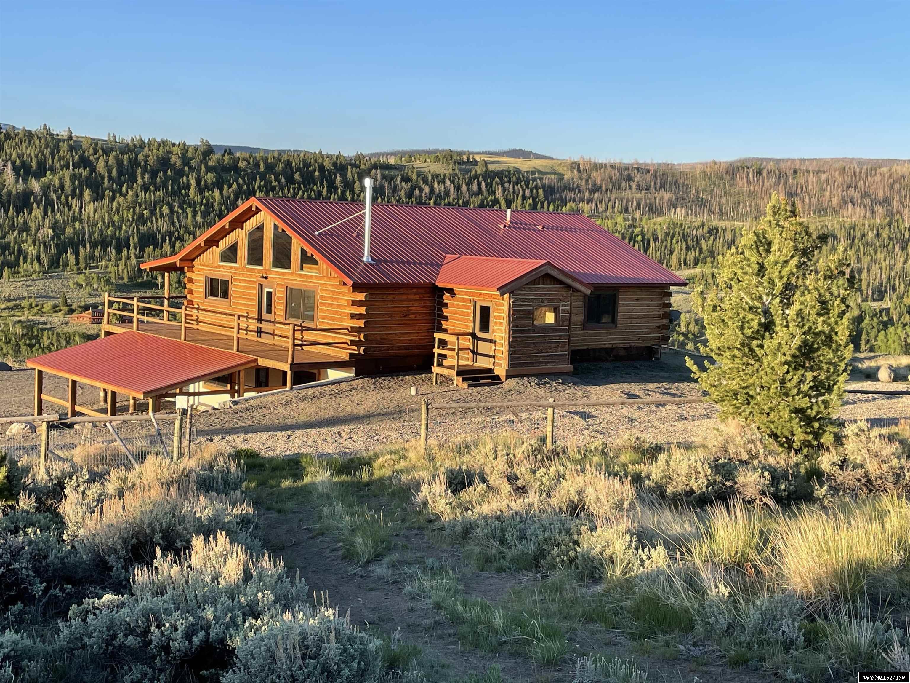 Views, location, and wildlife. This 30 acre property borders public lands, allowing for endless recreational opportunities. This 3 BR, 3BA home boasts an open floor plan, kitchen made for entertaining, walk in showers in each bathroom, and lots of natural light. A two car garage and dual carport for all the toys. There is an attached greenhouse and sauna in the walk out basement. Call for an appointment to appreciate the attention to details in this exquisite property that has a great short term rental history. Shown by appointment only.