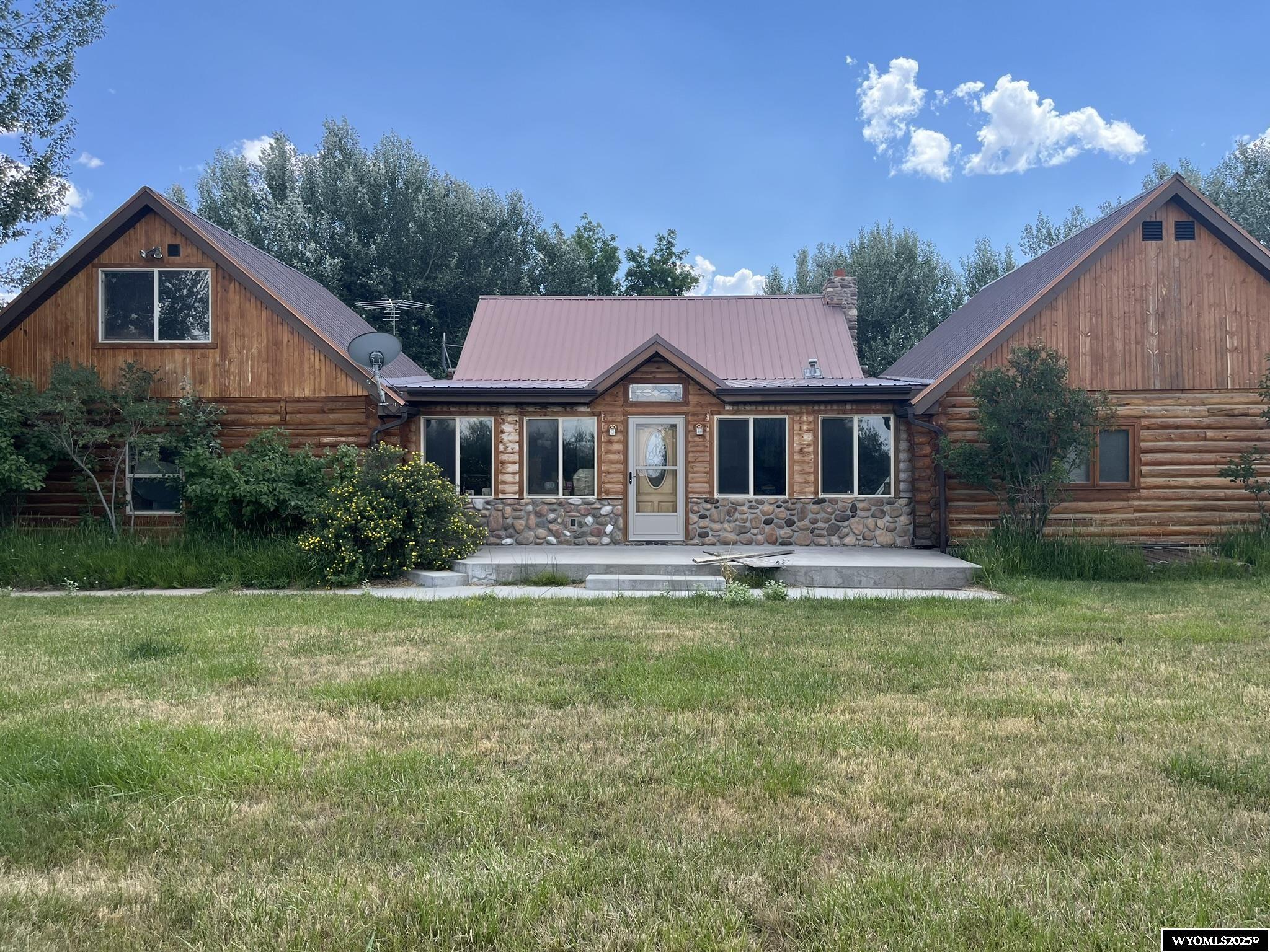 Beautiful flood-irrigated meadows, lots of highway and county road frontage hidden behind tree lines. Home and several out-buildings, corrals.