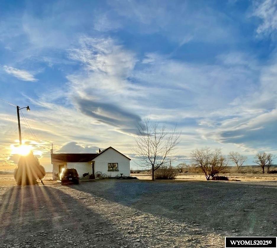 Take a look at this farmstead, with home, shop, and corrals on approximately 63 acres. There is a small irrigated pasture and sub irrigated river bottom. Amazing wildlife and hunting opportunities are a bonus on this property, with elk migrating through most fall and winter seasons. Mule deer, whitetail deer, antelope, and pheasant are abundant. The current owner has harvested elk on the property. Mountain views, natural springs, and river, all on the property, create a beautiful living environment. This property boasts a heated and insulated 40x60 shop, corrals, and loafing shed, all currently in use and in working order. For those longing to live on the land, this is an amazing opportunity! Taxes are TBD, as this is being split from a larger parcel. $3,500 is an estimate of what taxes may be. A survey is being done and a legal description is forthcoming.